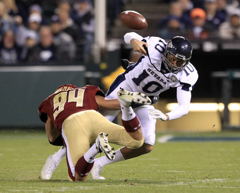 SAN FRANCISCO, CA - JANUARY 09:  Colin Kaepernick #10 of the Nevada Wolf Pack fumbles the ball after being hit by Mark Herzlich #94 of the Boston College during the Kraft Fight Hunger Bowl at AT&T Park on January 9, 2011 in San Francisco, California.  (Ph