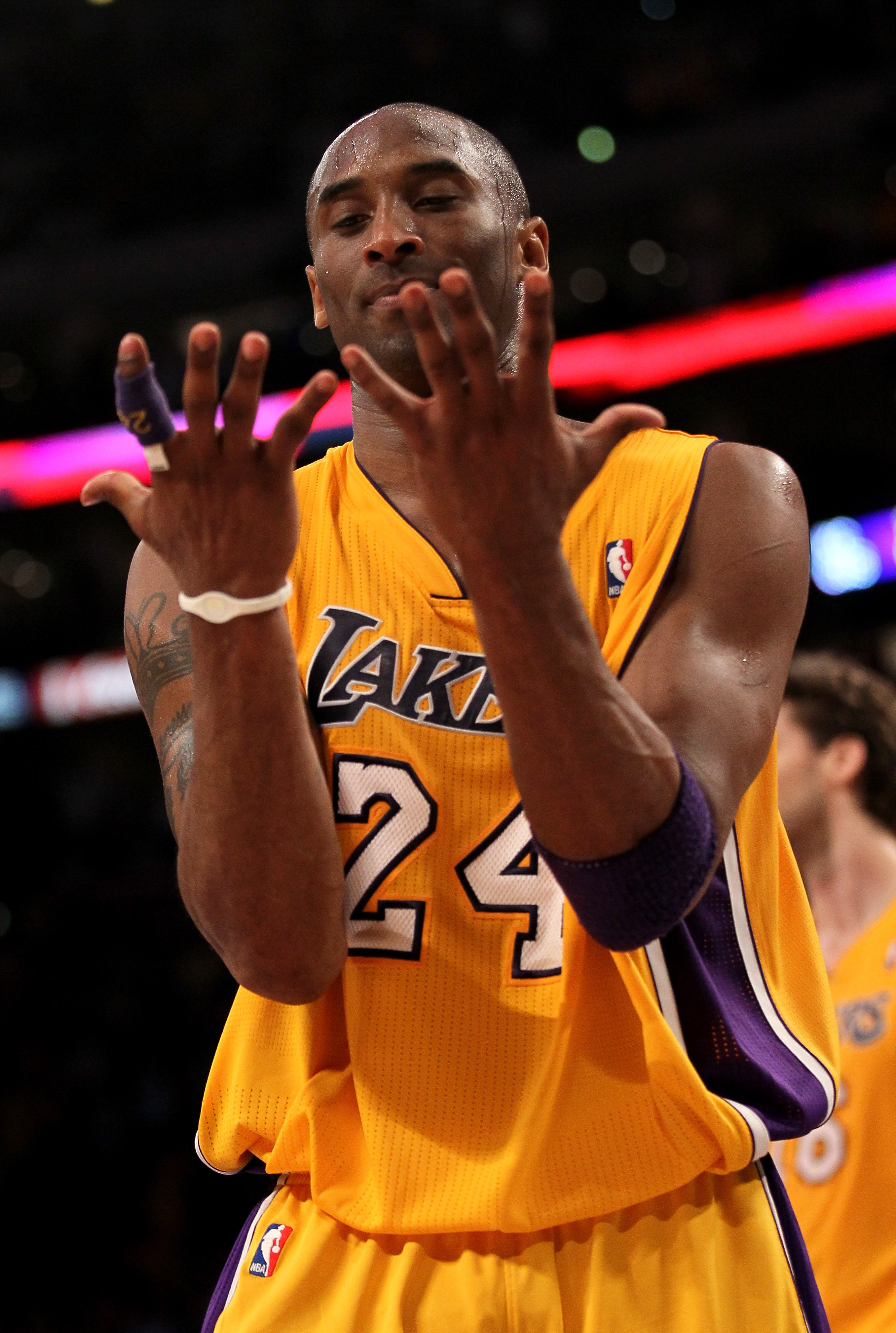 LOS ANGELES, CA - APRIL 5:  Kobe Bryant #24 of the Los Angeles Lakers looks at his hands as he walks off the court after losing control of the ball while going for the potential game winning shot in the final seconds against the Utah Jazz at Staples Cente