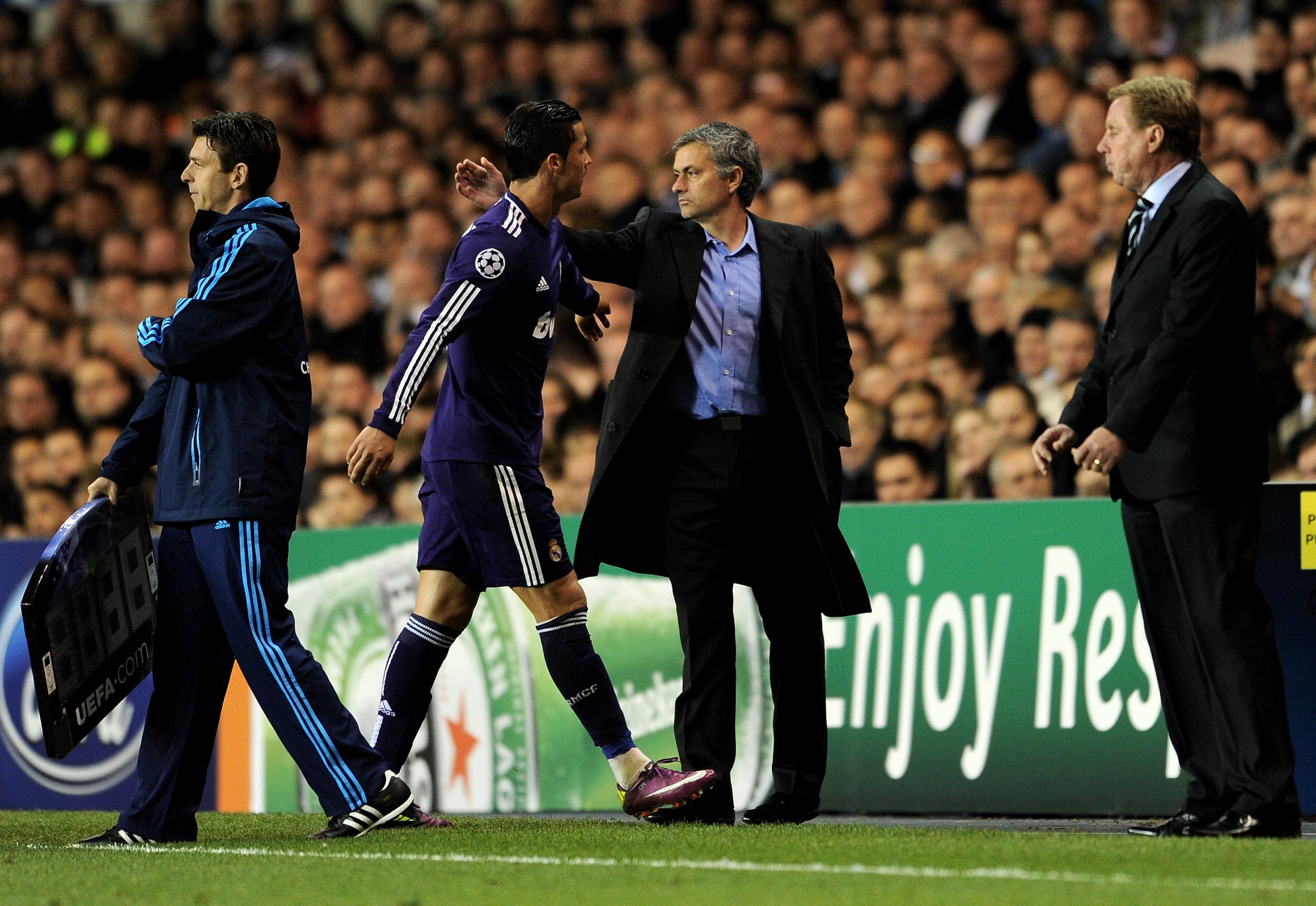 LONDON, ENGLAND - APRIL 13: Manager Jose Mourinho congratulates Cristiano Ronaldo of Real Madrid as he leaves the pitch during the UEFA Champions League quarter final second leg match between Tottenham Hotspur and Real Madrid at White Hart Lane on April 1