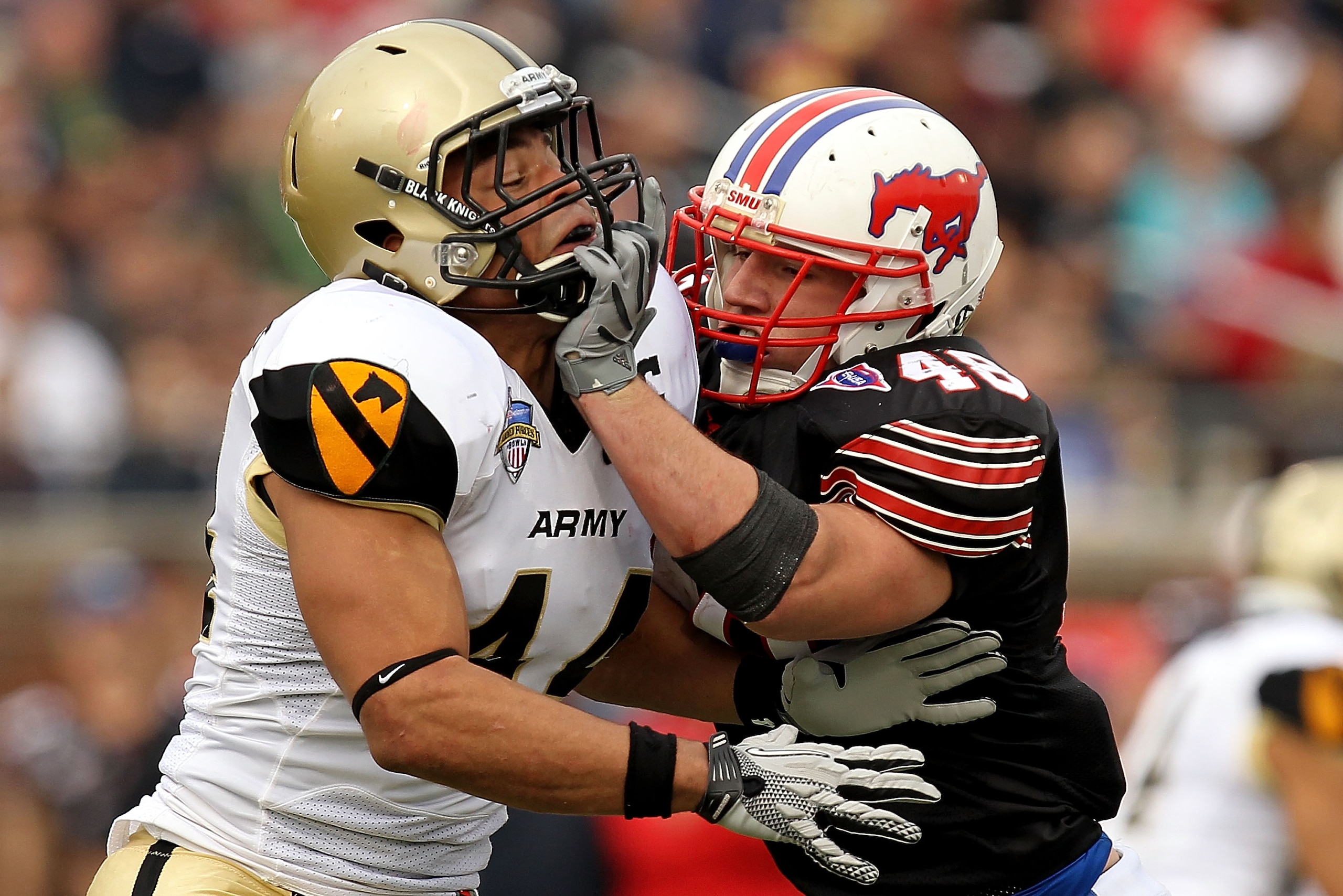 DALLAS, TX - DECEMBER 30:  Defensive end Joshua McNary #44 of the Army Black Knights defends the play against Zach Line #48 of the SMU Mustangs during the Bell Helicopter Armed Forces Bowl at Gerald J. Ford Stadium on December 30, 2010 in Dallas, Texas.