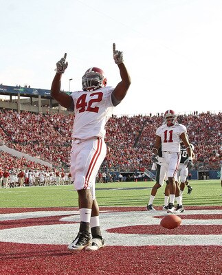 ORLANDO, FL - JANUARY 01:  Eddie Lacy #42 of the Alabama Crimson Tide celebrates after rushing for a touchdown during the Capitol One Bowl against the Michigan State Spartans at the Florida Citrus Bowl on January 1, 2011 in Orlando, Florida.  (Photo by Mi