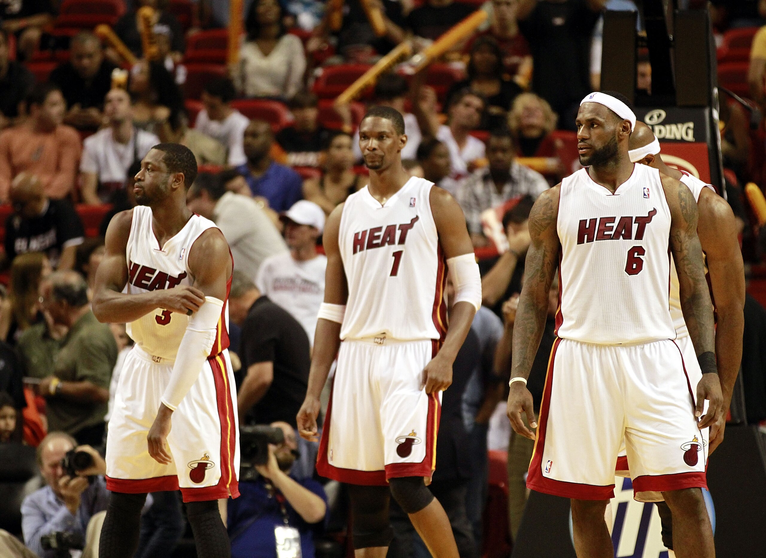 MIAMI, FL - MARCH 25:  Forward Chris Bosh #1, Forward LeBron James #6 and Guard Dwyane Wade #3 of the Miami Heat against the Philadelphia 76ers at American Airlines Arena on March 25, 2011 in Miami, Florida. The Heat defeated the Sixers 111-99. NOTE TO US