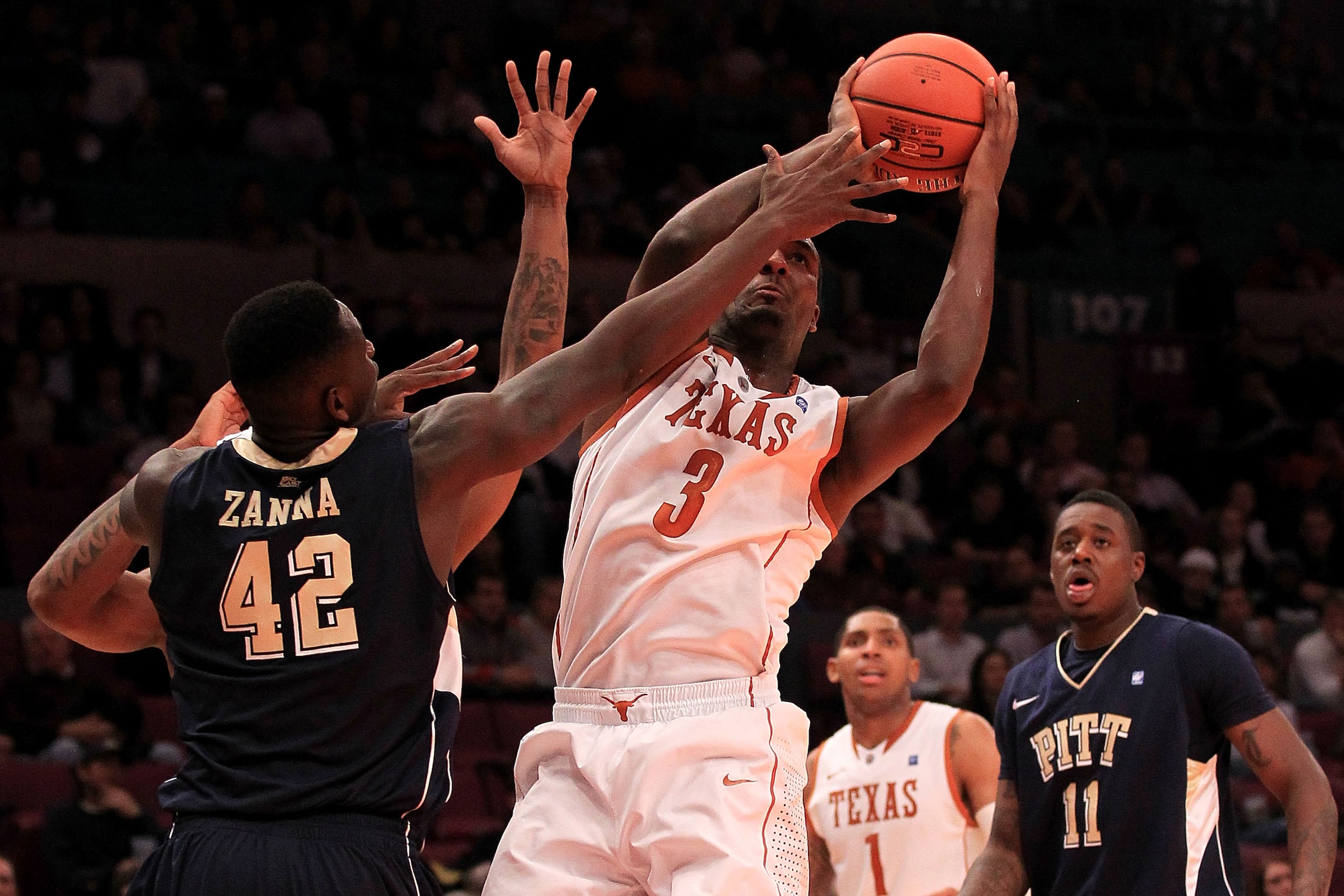 NEW YORK - NOVEMBER 19:  Jordan Hamilton #3 of the Texas Longhorns shoots around Talib Zanna #42 of the Pittsburgh Panthers during the Championship game of the 2k Sports Classic at Madison Square Garden on November 19, 2010 in New York, New York.  (Photo