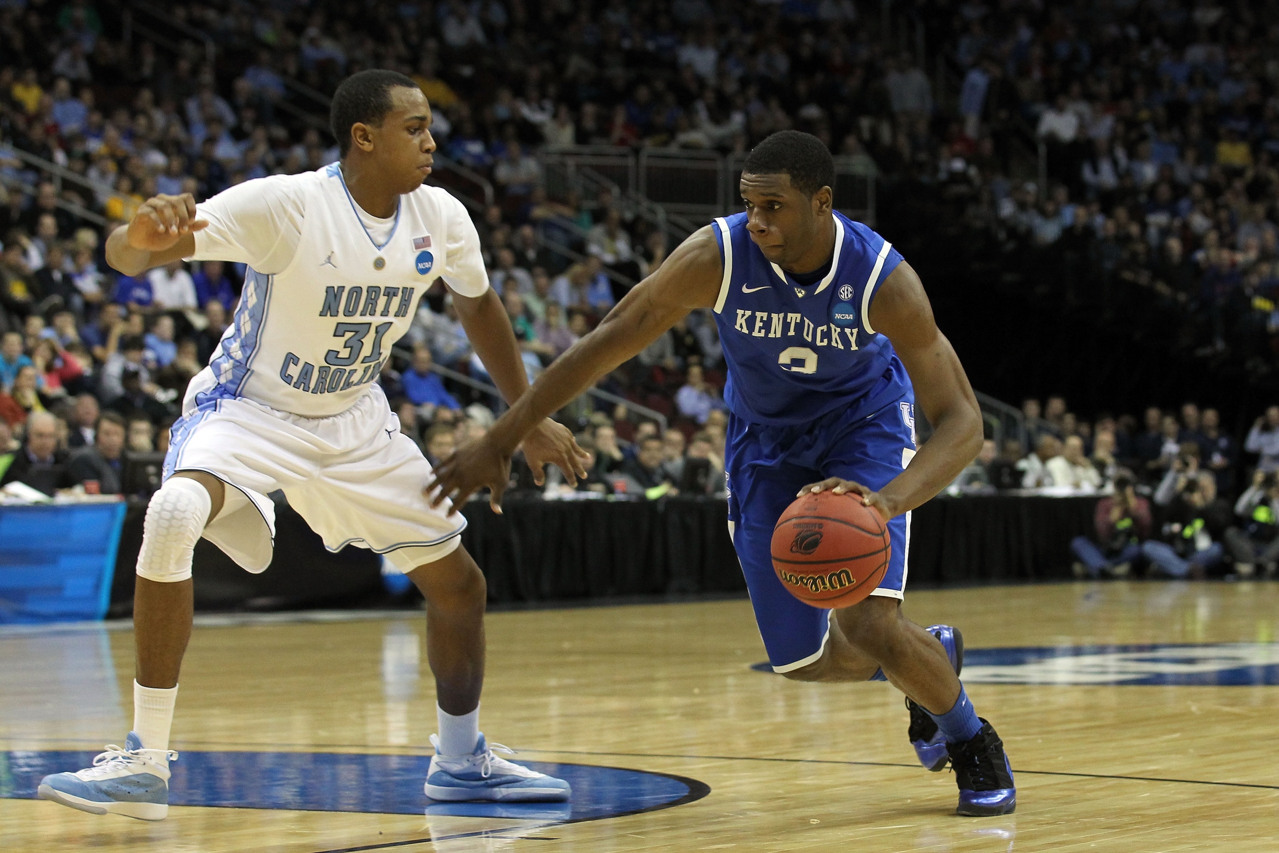 NEWARK, NJ - MARCH 27:  Terrence Jones #3 of the Kentucky Wildcats dribbles the ball against John Henson #31 of the North Carolina Tar Heels during the first half ofthe east regional final of the 2011 NCAA men's basketball tournament at Prudential Center