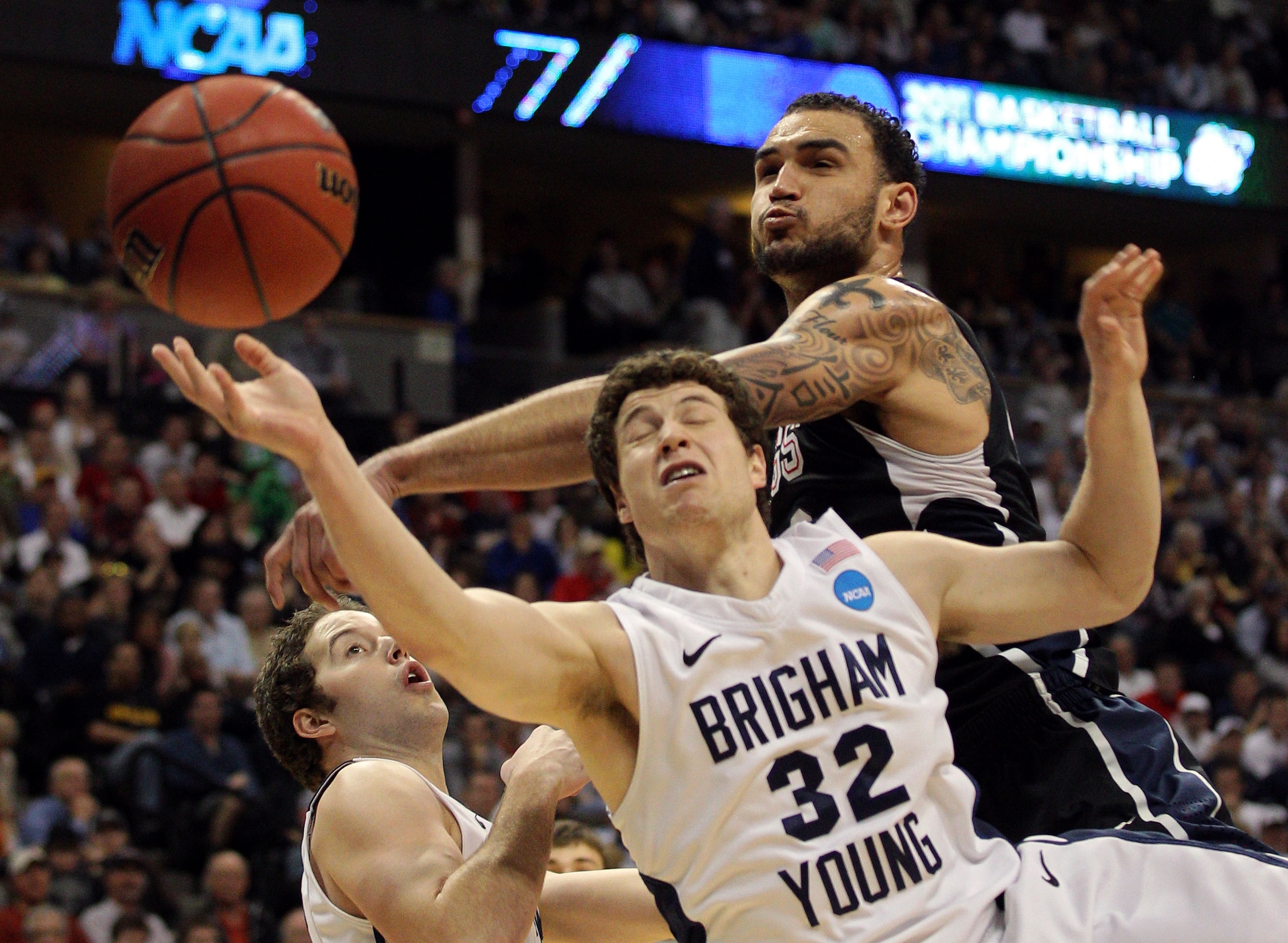 DENVER, CO - MARCH 19:  Robert Sacre #00 of the Gonzaga Bulldogs blocks the shot of Jimmer Fredette #32 of the Brigham Young Cougars during the third round of the 2011 NCAA men's basketball tournament at Pepsi Center on March 19, 2011 in Denver, Colorado.