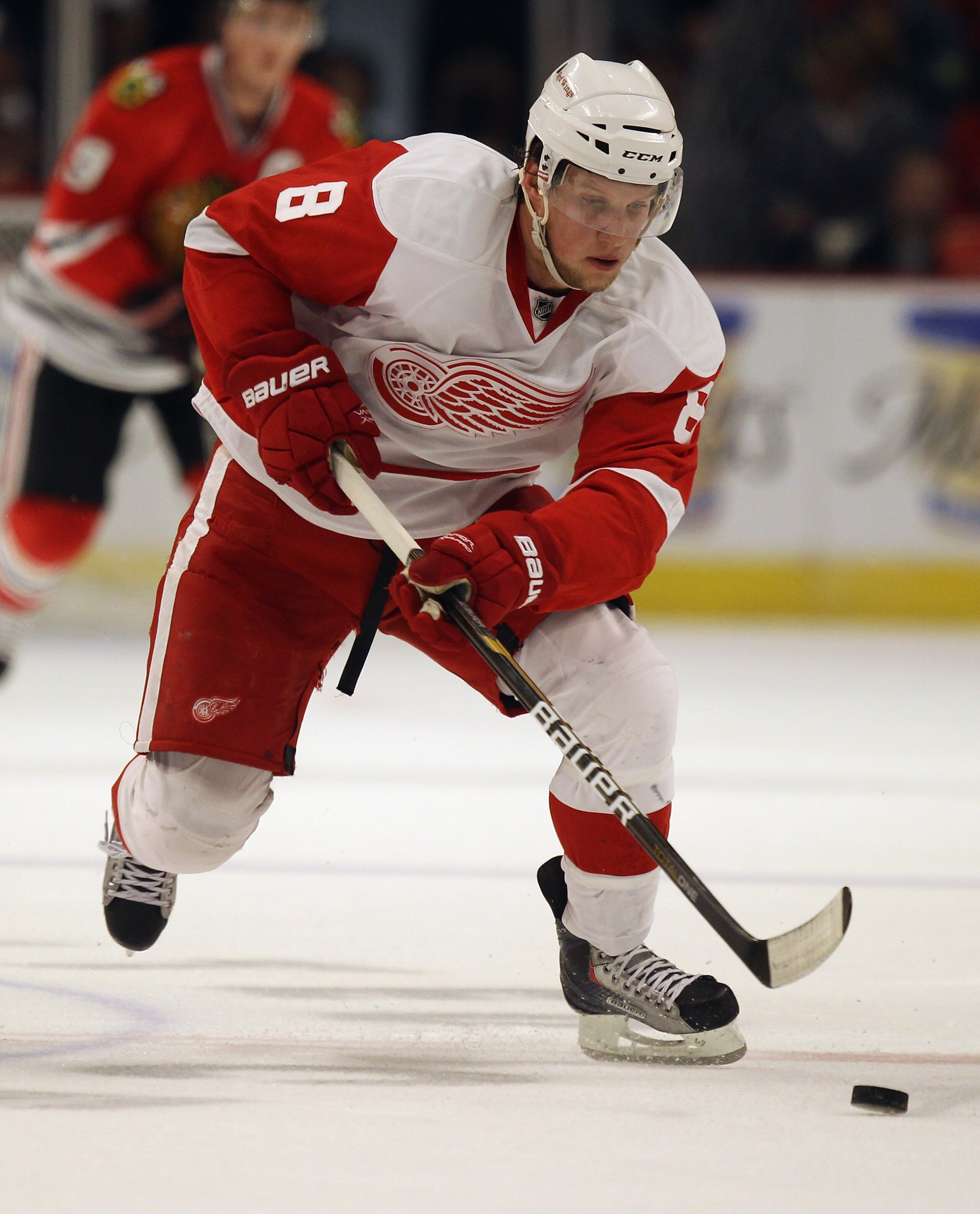 CHICAGO, IL - APRIL 10: Justin Abdelkader #8 of the Detroit Red Wings moves to the puck against the Chicago Blackhawks at the United Center on April 10, 2011 in Chicago, Illinois. The Red Wings defeated the Blackhawks 4-3. (Photo by Jonathan Daniel/Getty