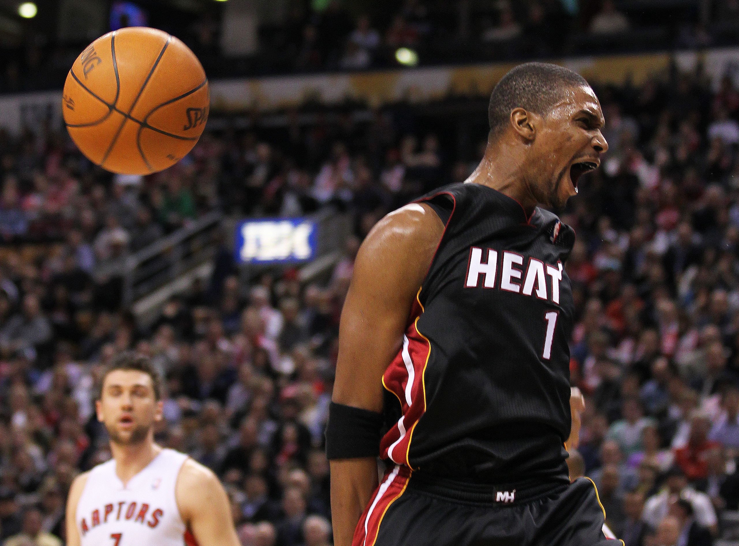TORONTO, CANADA - FEBRUARY 16:  Chris Bosh #1 of the Miami Heat reacts to a big slam in a game against the Toronto Raptors on February 16, 2011 at the Air Canada Centre in Toronto, Canada. The Heat defeated the Raptors 103-95. (Photo by Claus Andersen/Get