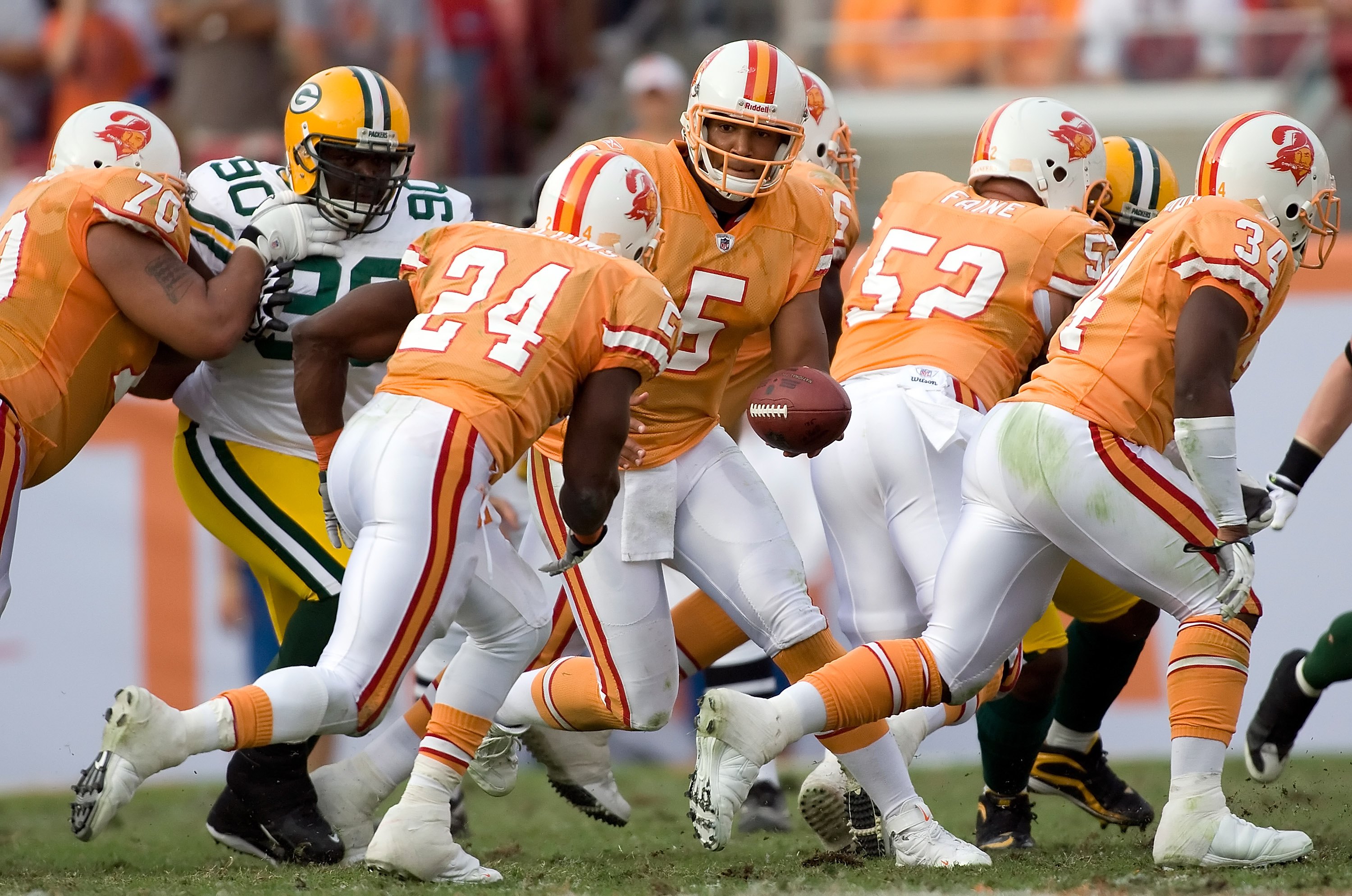 TAMPA, FL - NOVEMBER 08:  Quarterback Josh Freeman #5 of the Tampa Bay Buccaneers hands the ball off against the Green Bay Packers during the game at Raymond James Stadium on November 8, 2009 in Tampa, Florida. The Buccaneers defeated the Packers 38-28.