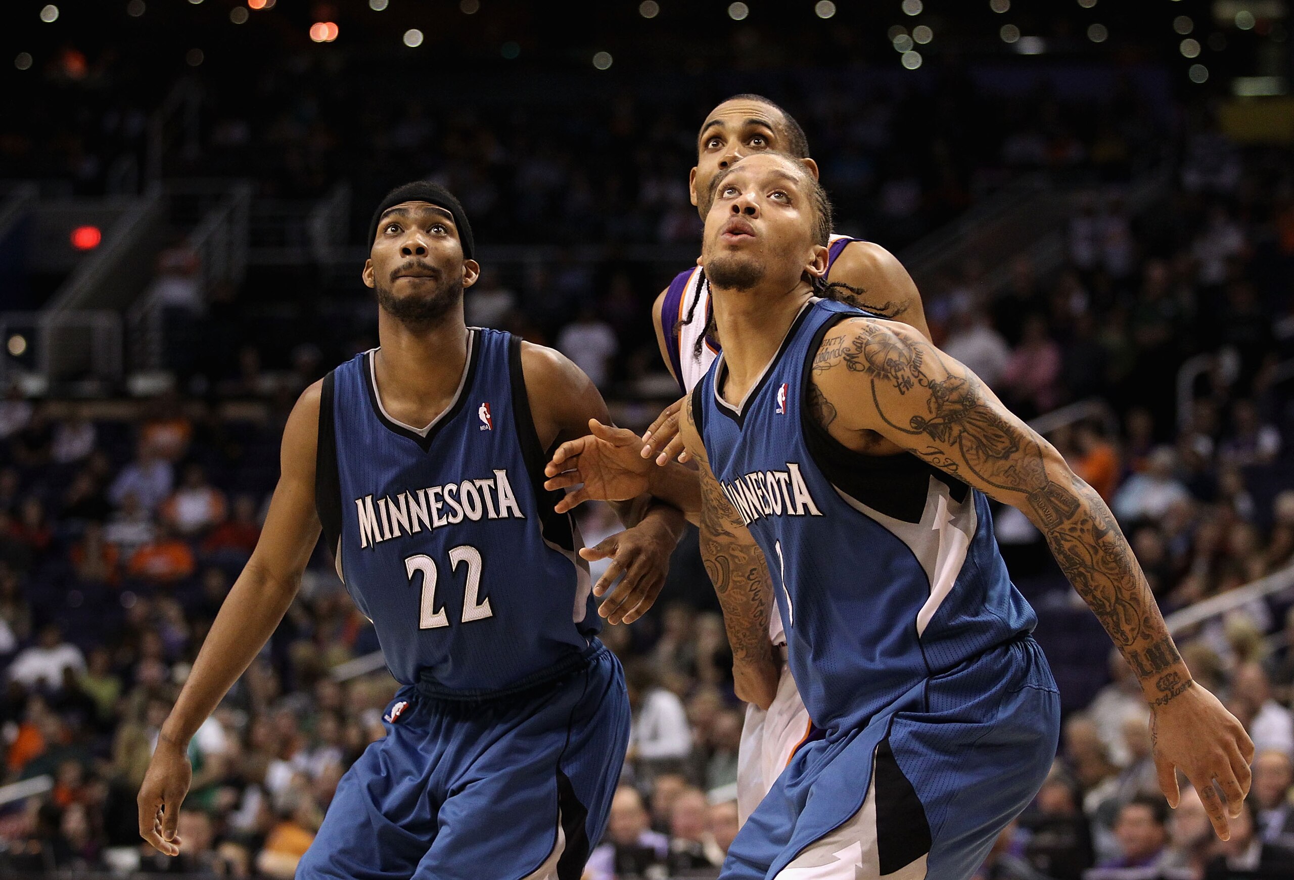 PHOENIX - DECEMBER 15:  Corey Brewer #22 and Michael Beasley #22 of the Minnesota Timberwolves block out Grant Hill #33 of the Phoenix Suns during the NBA game at US Airways Center on December 15, 2010 in Phoenix, Arizona.  The Suns defeated the Timberwol