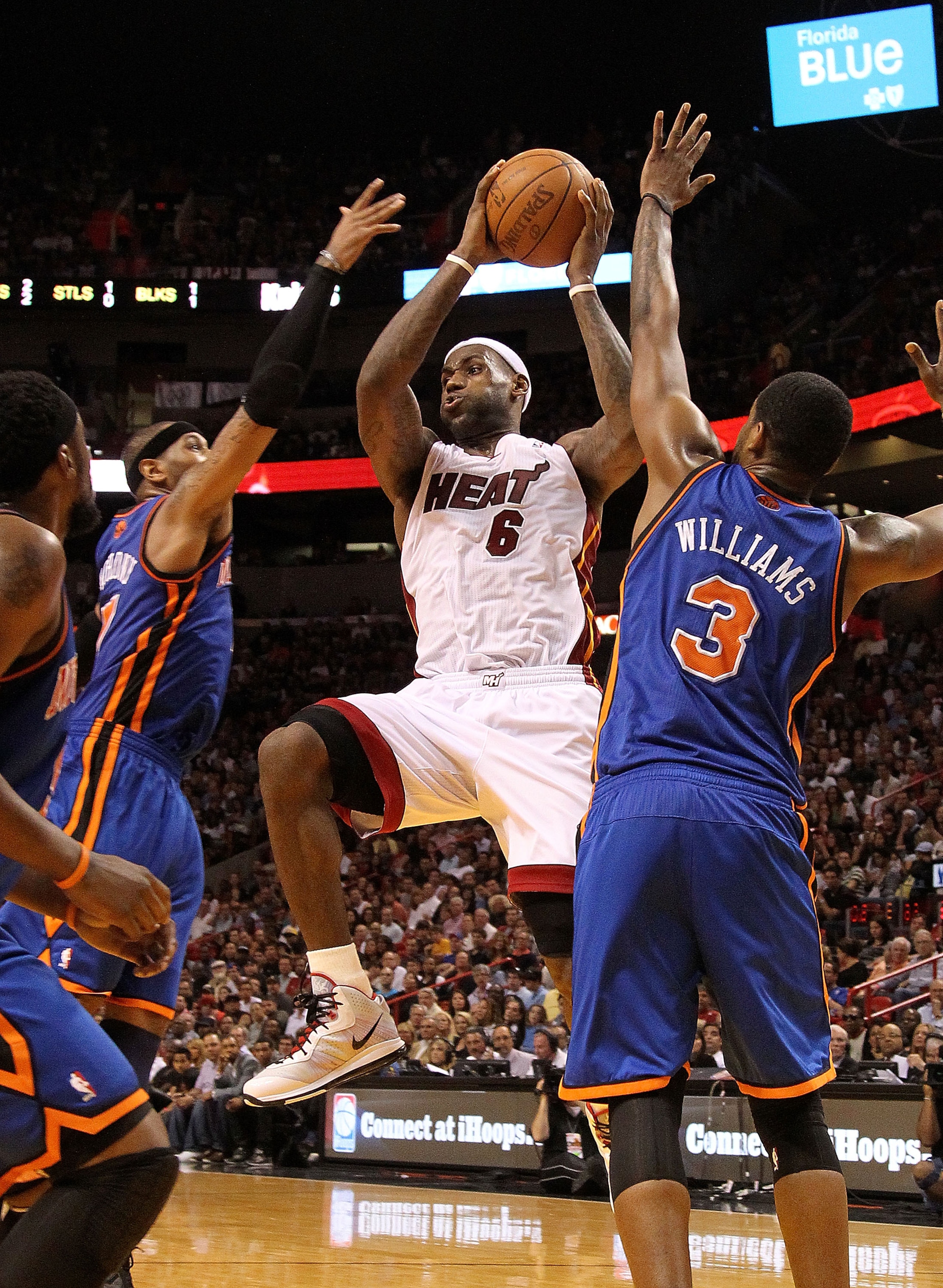 MIAMI, FL - FEBRUARY 27:  LeBron James #6 of the Miami Heat is guarded by Carmelo Anthony #7 and Shawne Williams #3 of the New York Knicks looks on during a game at American Airlines Arena on February 27, 2011 in Miami, Florida. NOTE TO USER: User express