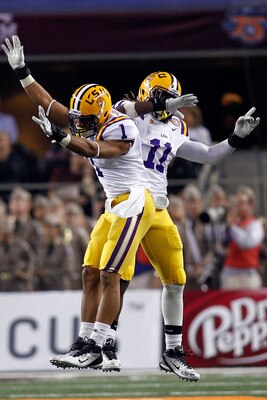 ARLINGTON, TX - JANUARY 07:  Eric Reid #1 and Kelvin Sheppard #11 of the Louisiana State University Tigers celebrate after an interception during the game against the Texas A&M Aggies during the AT&T Cotton Bowl at Cowboys Stadium on January 7, 2011 in Ar