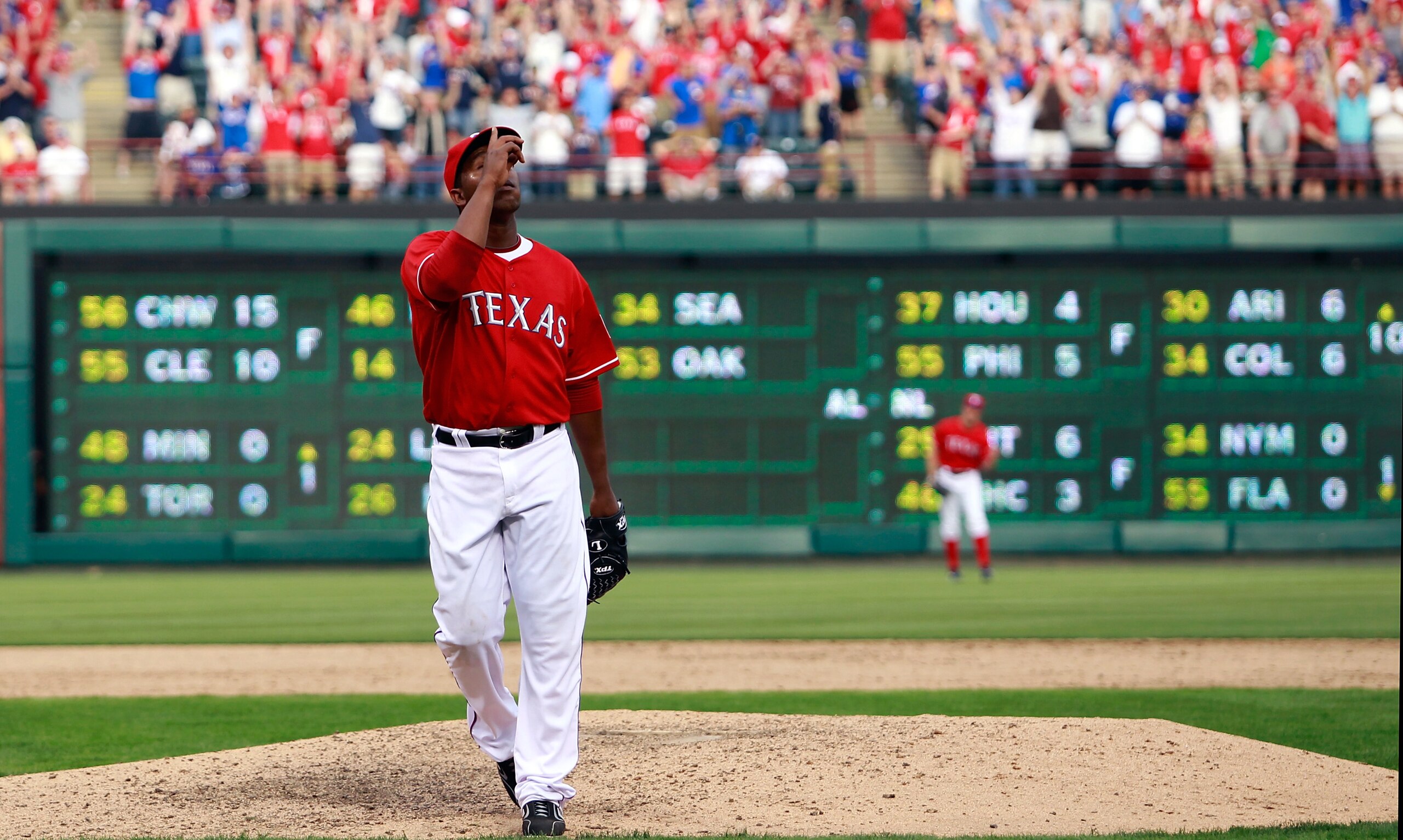 ARLINGTON, TX - APRIL 01: Closing pitcher Neftali Feliz #30 of the Texas Rangers celebrates after closing out the top of the ninth inning against the Boston Red Sox on Opening Day at Rangers Ballpark in Arlington on April 1, 2011 in Arlington, Texas. (P ARLINGTON, TX - APRIL 01: Closing pitcher Neftali Feliz #30 of the Texas Rangers celebrates after closing out the top of the ninth inning against the Boston Red Sox on Opening Day at Rangers Ballpark in Arlington on April 1, 2011 in Arlington, Texas. (P