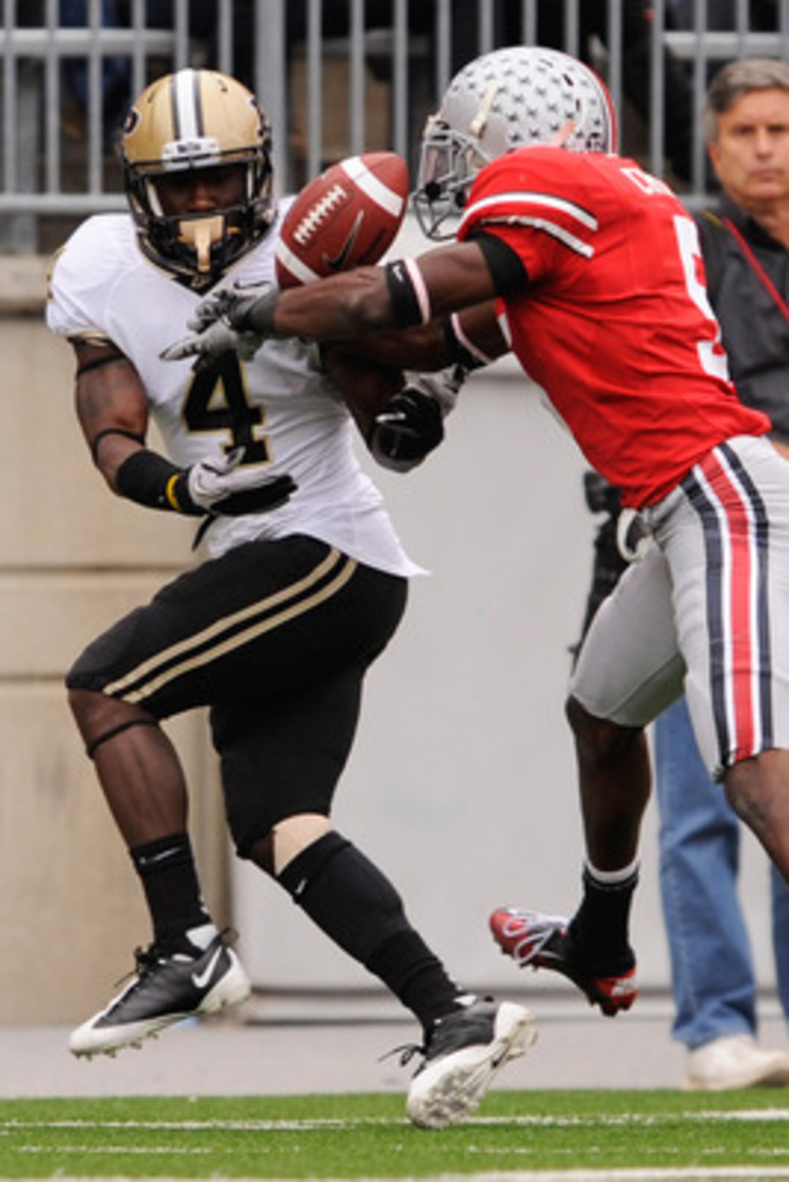 COLUMBUS, OH - OCTOBER 23:  Chimdi Chekwa #5 of the Ohio State Buckeyes breaks up a pass intended for O.J. Ross #4 of the Purdue Boilermakers at Ohio Stadium on October 23, 2010 in Columbus, Ohio.  (Photo by Jamie Sabau/Getty Images)