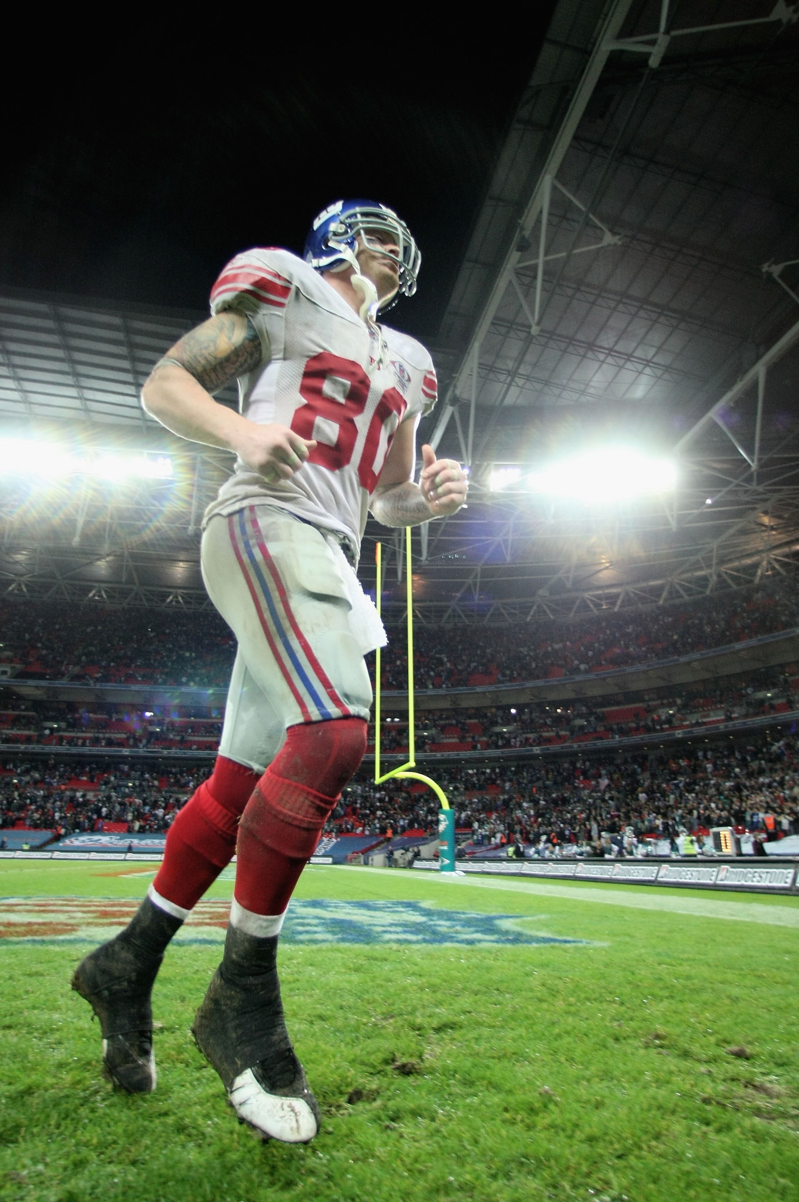 LONDON - OCTOBER 28: Jeremy Shockey #80 of the Giants runs off the pitch following his team's 13-10 victory during the NFL Bridgestone International Series match between New York Giants and Miami Dolphins at Wembley Stadium on October 28, 2007 in London LONDON - OCTOBER 28: Jeremy Shockey #80 of the Giants runs off the pitch following his team's 13-10 victory during the NFL Bridgestone International Series match between New York Giants and Miami Dolphins at Wembley Stadium on October 28, 2007 in London