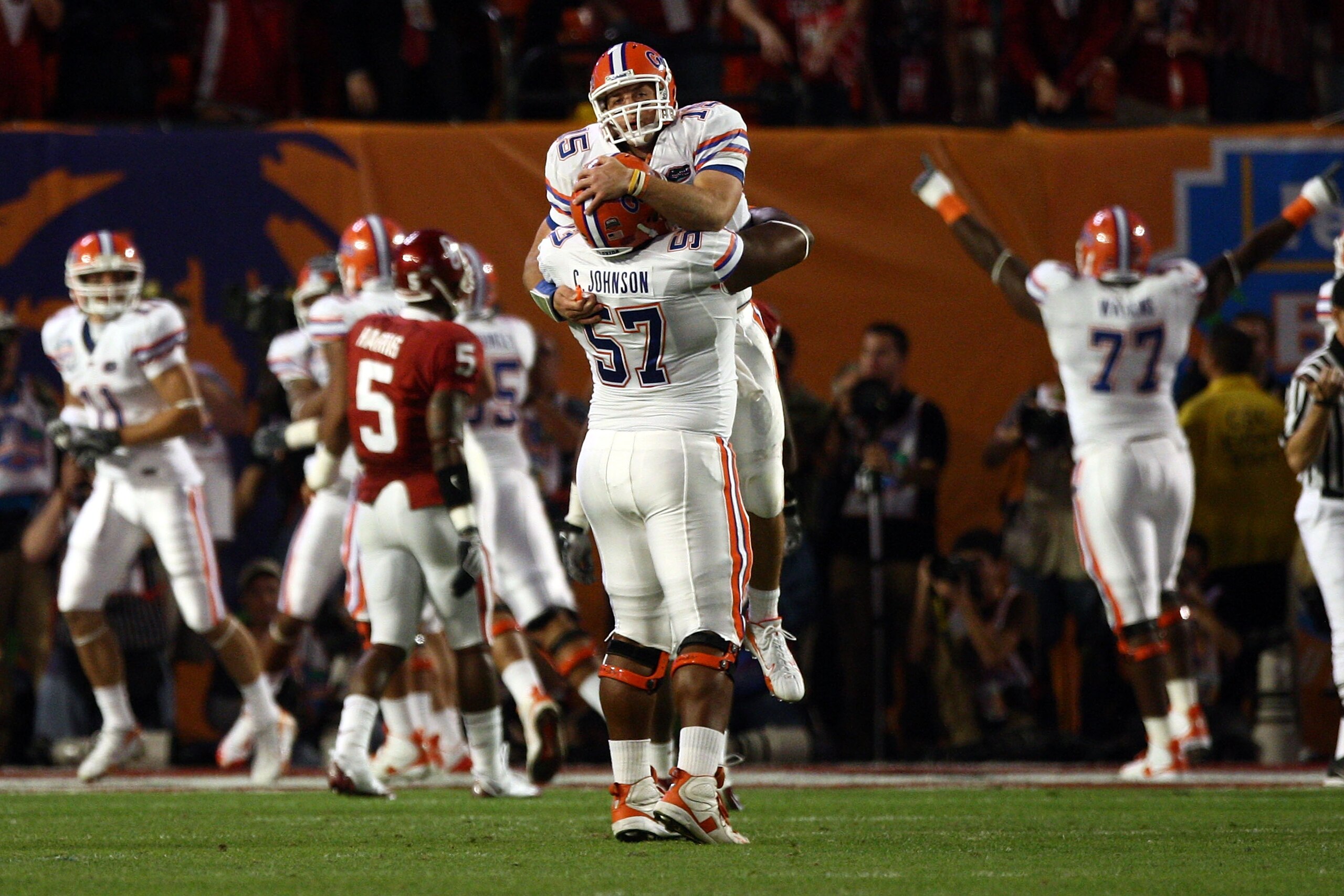 MIAMI - JANUARY 08:  Quarterback Tim Tebow of the Florida Gators celebrates with teammate Carl Johnson #57 after throwing for a touchdown against the Oklahoma Sooners in the FedEx BCS National Championship Game at Dolphin Stadium on January 8, 2009 in Mia