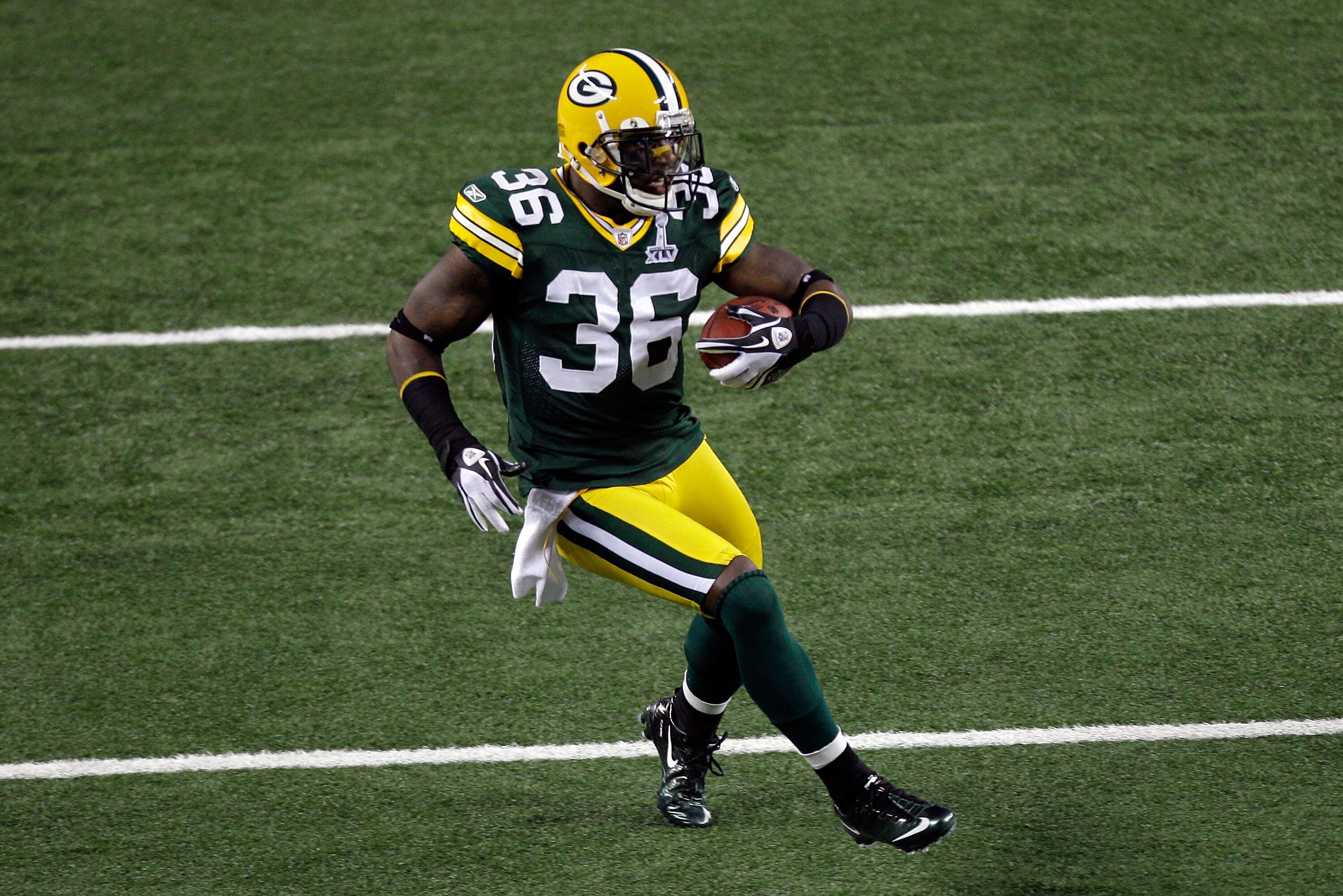 ARLINGTON, TX - FEBRUARY 06:  Nick Collins #36 of the Green Bay Packers runs 37 yards for a touchdown after making an interception in the first quarter against the Pittsburgh Steelers during Super Bowl XLV at Cowboys Stadium on February 6, 2011 in Arlingt