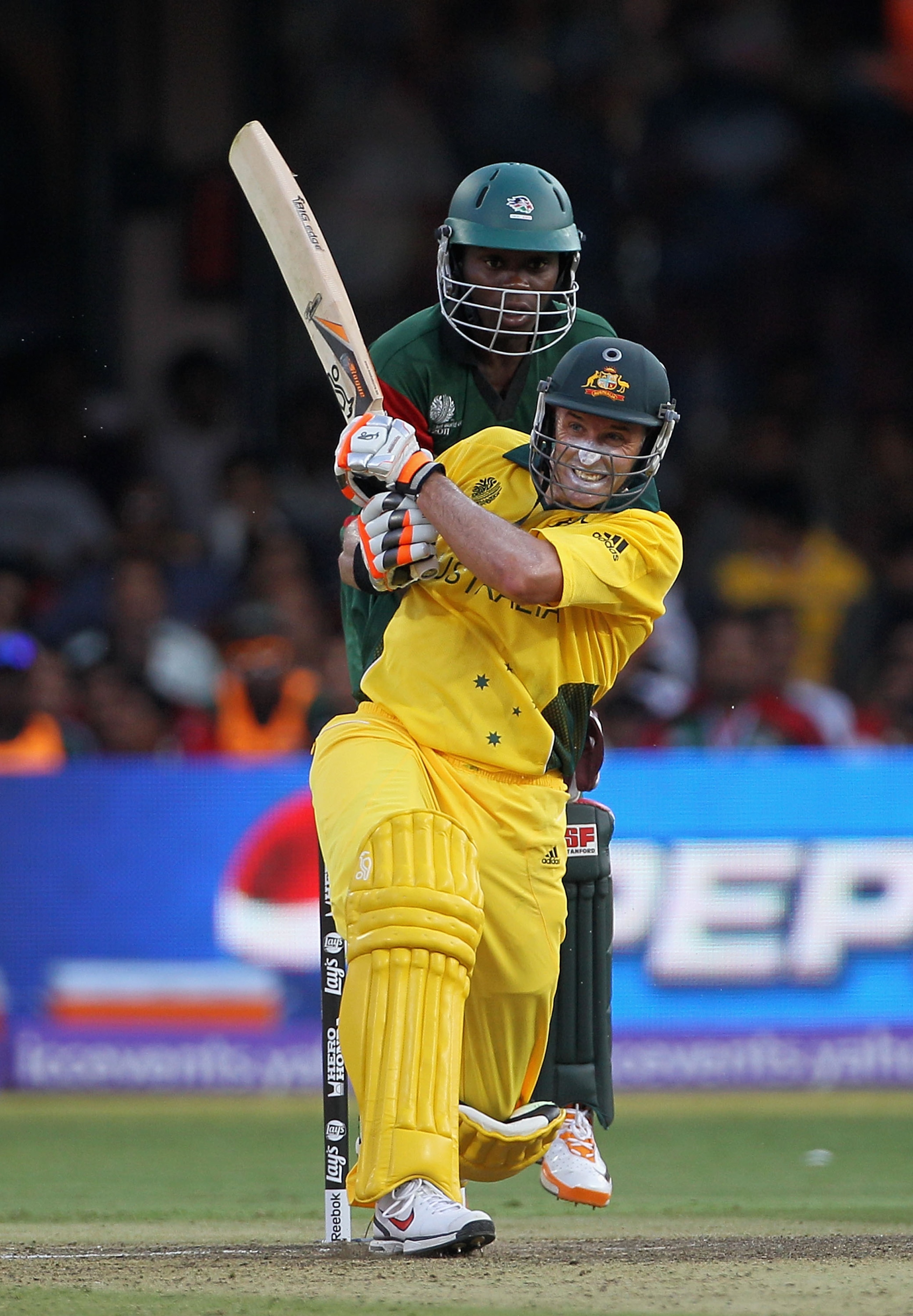 BANGALORE, INDIA - MARCH 13: Michael Hussey of Australia pulls with Maurice Ouma of Kenya looking on during the 2011 ICC World Cup Group A match between Australia and Kenya at M. Chinnaswamy Stadium on March 13, 2011 in Bangalore, India. (Photo by Hamis BANGALORE, INDIA - MARCH 13: Michael Hussey of Australia pulls with Maurice Ouma of Kenya looking on during the 2011 ICC World Cup Group A match between Australia and Kenya at M. Chinnaswamy Stadium on March 13, 2011 in Bangalore, India. (Photo by Hamis