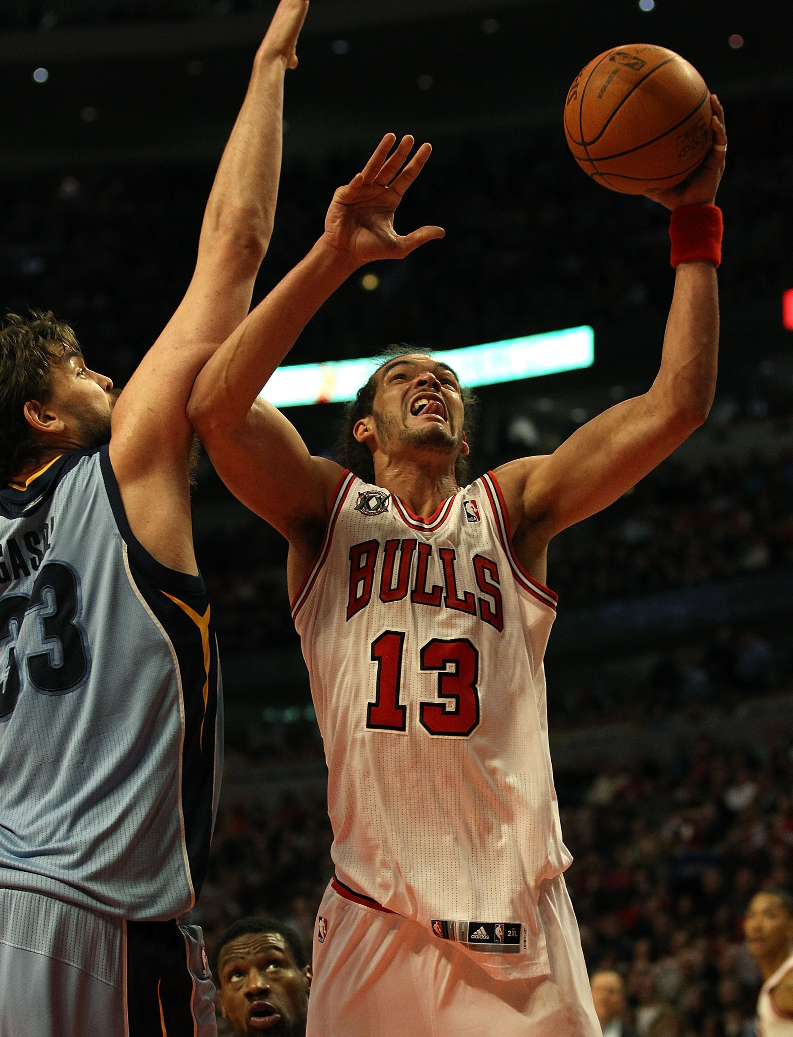 CHICAGO, IL - MARCH 25: Joakim Noah #13 of the Chicago Bulls puts up a shot against Marc Gasol #33 of the Memphis Girzzlies at the United Center on March 25, 2011 in Chicago, Illinois. The Bulls defeated the Grizzlies 99-96. NOTE TO USER: User expressly a CHICAGO, IL - MARCH 25: Joakim Noah #13 of the Chicago Bulls puts up a shot against Marc Gasol #33 of the Memphis Girzzlies at the United Center on March 25, 2011 in Chicago, Illinois. The Bulls defeated the Grizzlies 99-96. NOTE TO USER: User expressly a