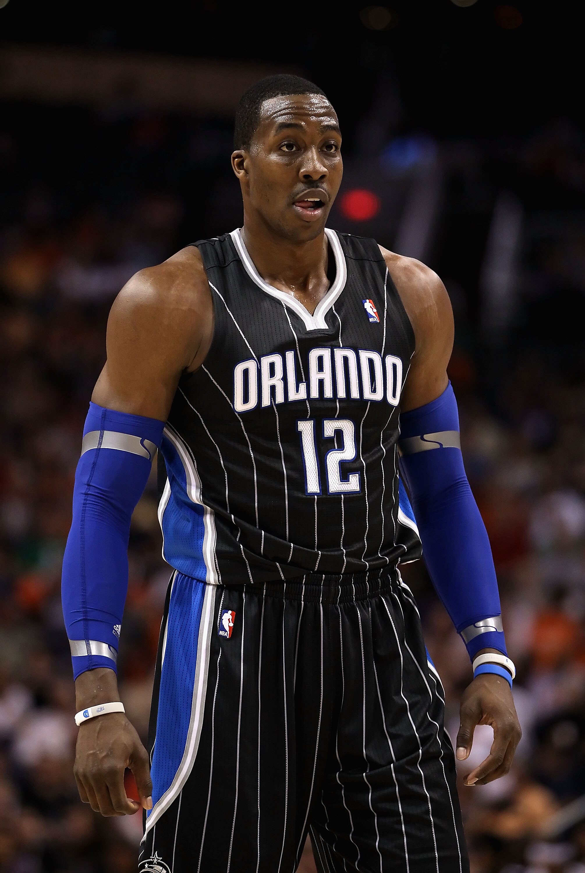 PHOENIX, AZ - MARCH 13:  Dwight Howard #12 of the Orlando Magic during the NBA game against the Phoenix Suns at US Airways Center on March 13, 2011 in Phoenix, Arizona. The Magic defeated the Suns 111-88. NOTE TO USER: User expressly acknowledges and agre