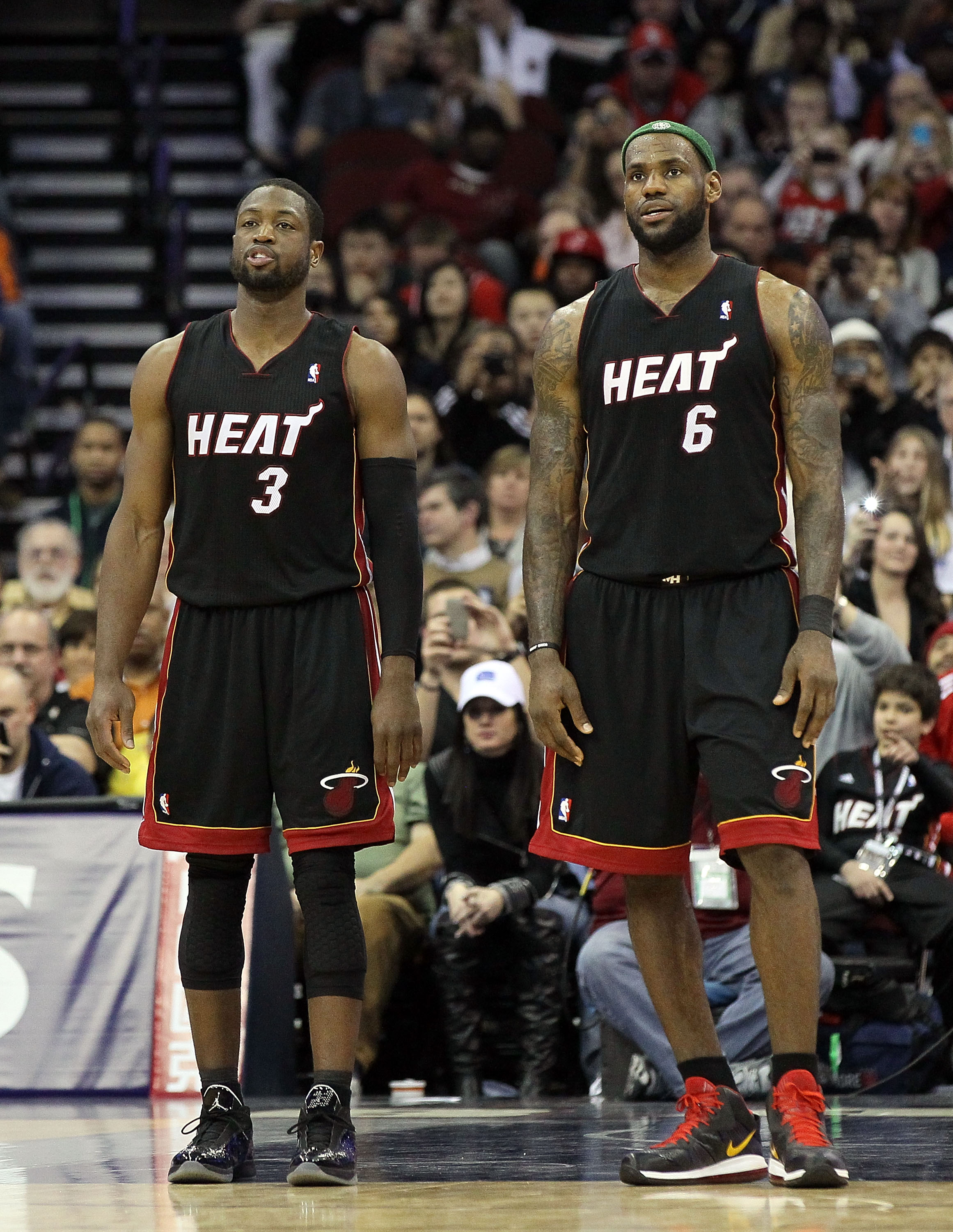NEWARK, NJ - APRIL 03:  LeBron James #6 and Dwyane Wade #3 of the Miami Heat look on against the New Jersey Nets at the Prudential Center on April 3, 2011 in Newark, New Jersey.The Heat defeated the Nets 108-94.NOTE TO USER: User expressly acknowledges an