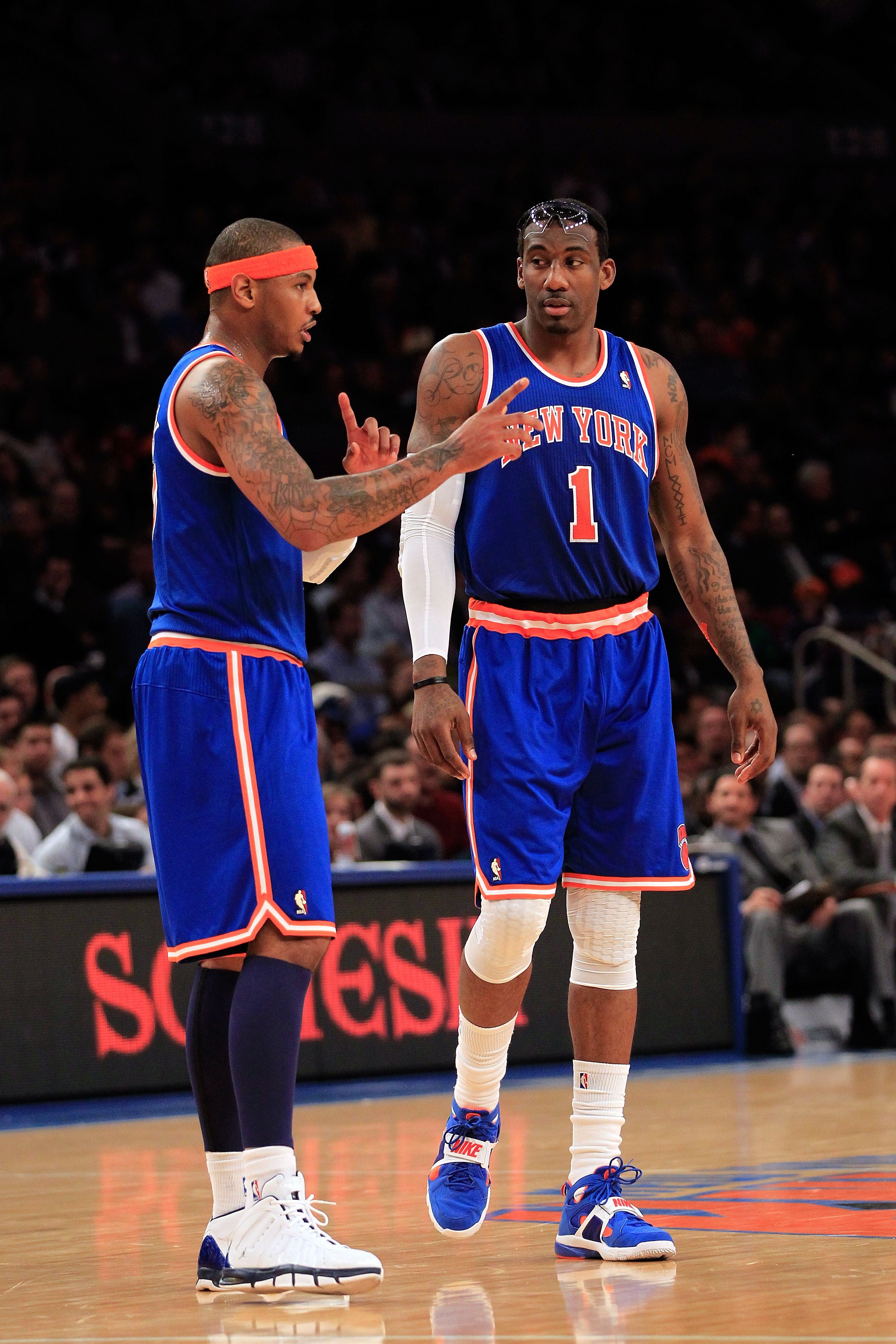 NEW YORK, NY - FEBRUARY 23: (L-R) Carmelo Anthony #7 and Amar'e Stoudemire #1 of the New York Knicks discuss tactics on the court against the Milwaukee Bucks at Madison Square Garden on February 23, 2011 in New York City. NOTE TO USER: User expressly ackn