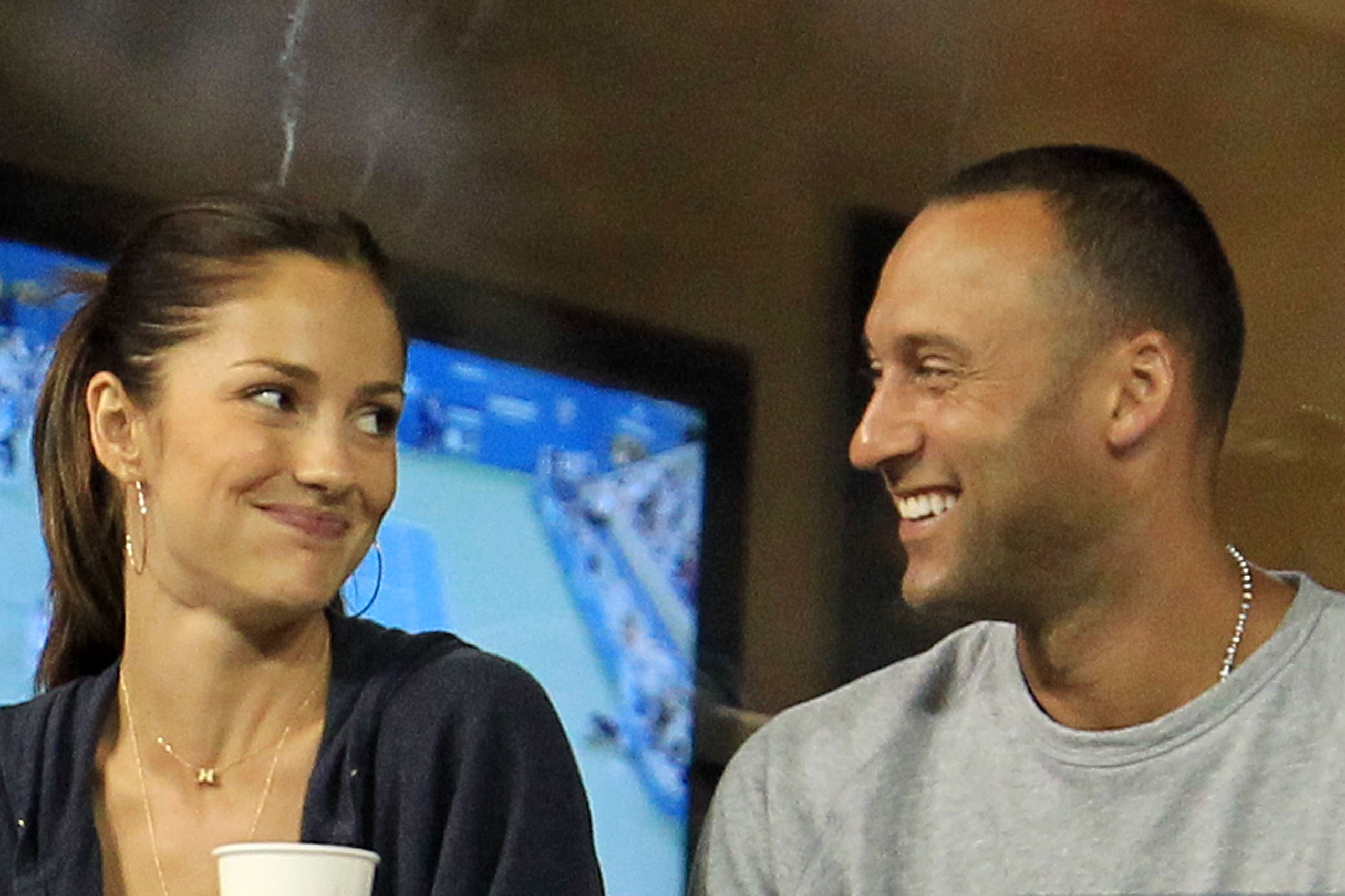 NEW YORK - SEPTEMBER 04:  Actress Minka Kelly and Derek Jeter of the New York Yanklees watch as Novak Djokovic of Serbia plays against James Blake of the United States during his men's singles match on day six of the 2010 U.S. Open at the USTA Billie Jean