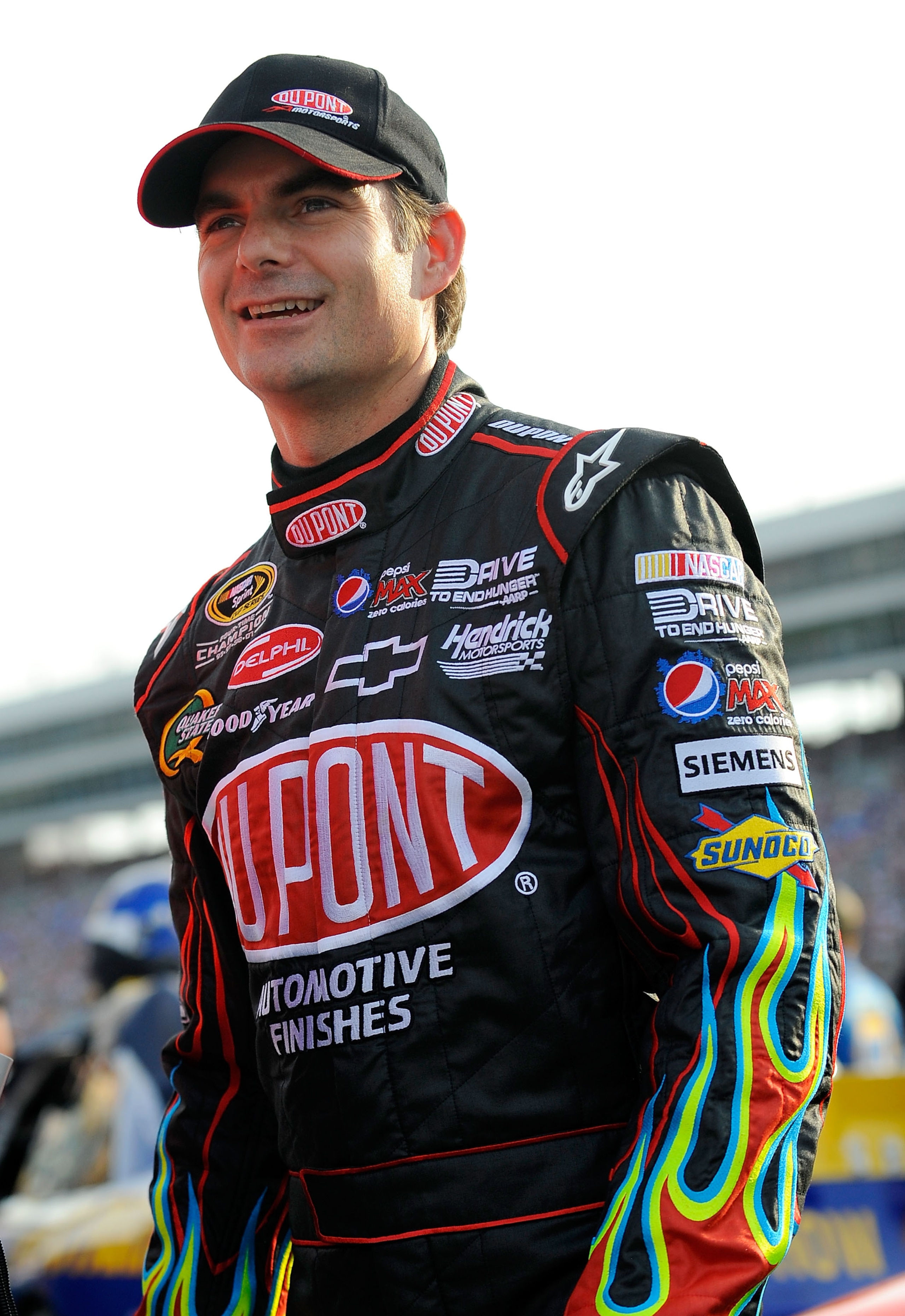 FORT WORTH, TX - APRIL 09:  Jeff Gordon, driver of the #24 DuPont Chevrolet, walks on the grid prior to the start of the NASCAR Sprint Cup Series Samsung Mobile 500 at Texas Motor Speedway on April 9, 2011 in Fort Worth, Texas.  (Photo by Jared C. Tilton/