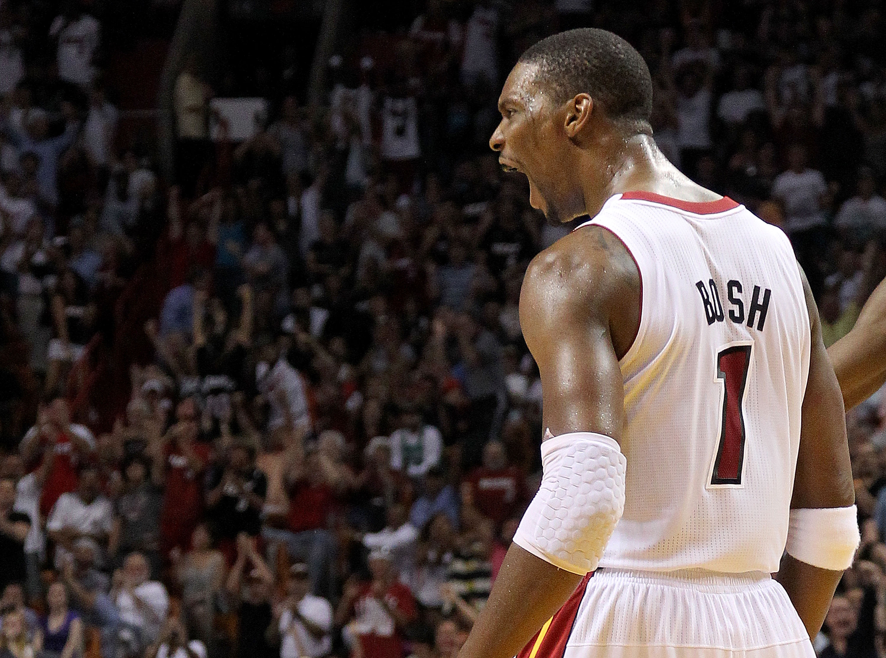 MIAMI, FL - APRIL 10: Chris Bosh #1 of the Miami Heat reacts after being fouled during a game against the Boston Celtics at American Airlines Arena on April 10, 2011 in Miami, Florida. NOTE TO USER: User expressly acknowledges and agrees that, by download