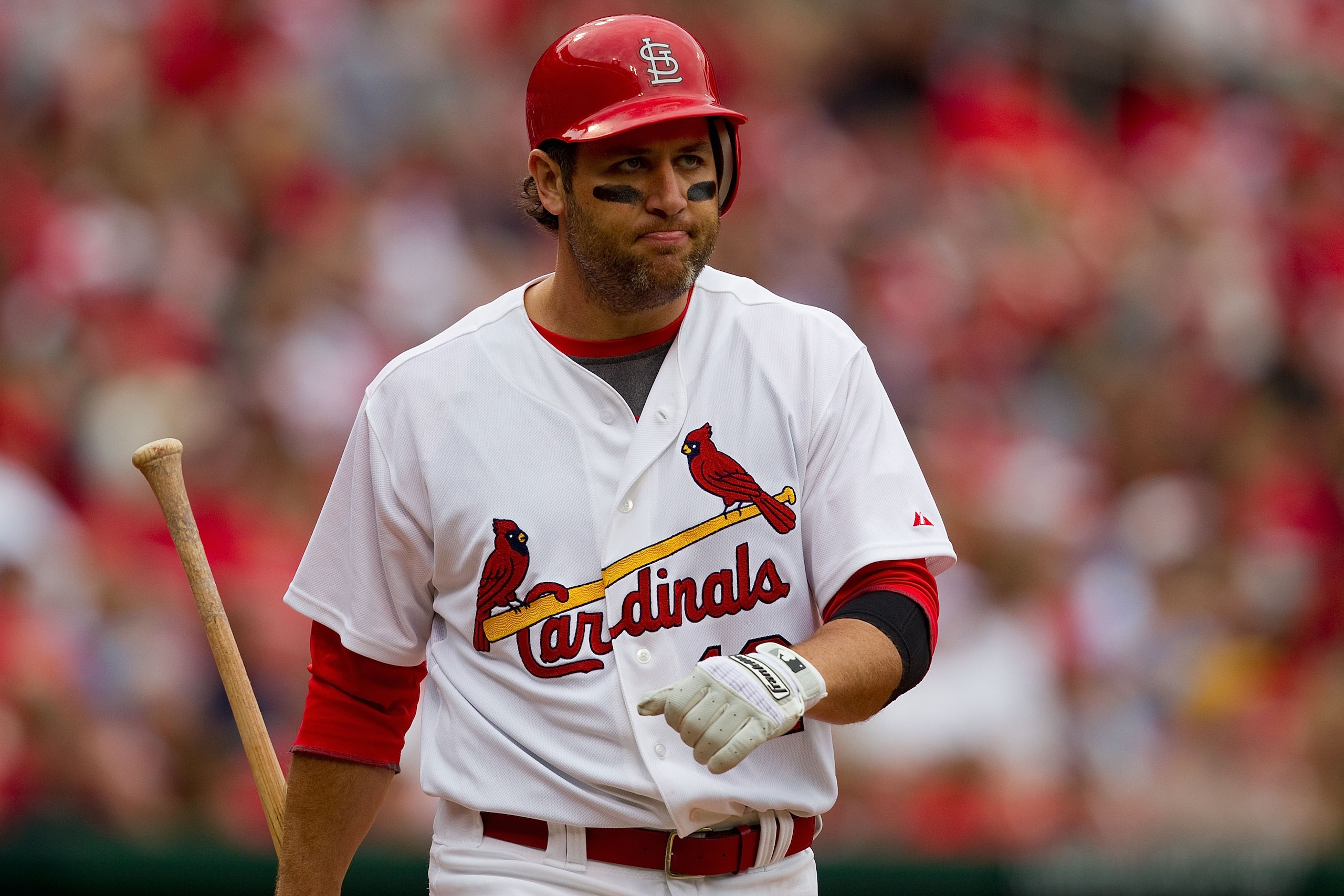 ST. LOUIS, MO - APRIL 2: Lance Berkman #12 of the St. Louis Cardinals returns to the dugout after striking out against the San Diego Padres at Busch Stadium on April 2, 2011 in St. Louis, Missouri.  (Photo by Dilip Vishwanat/Getty Images)