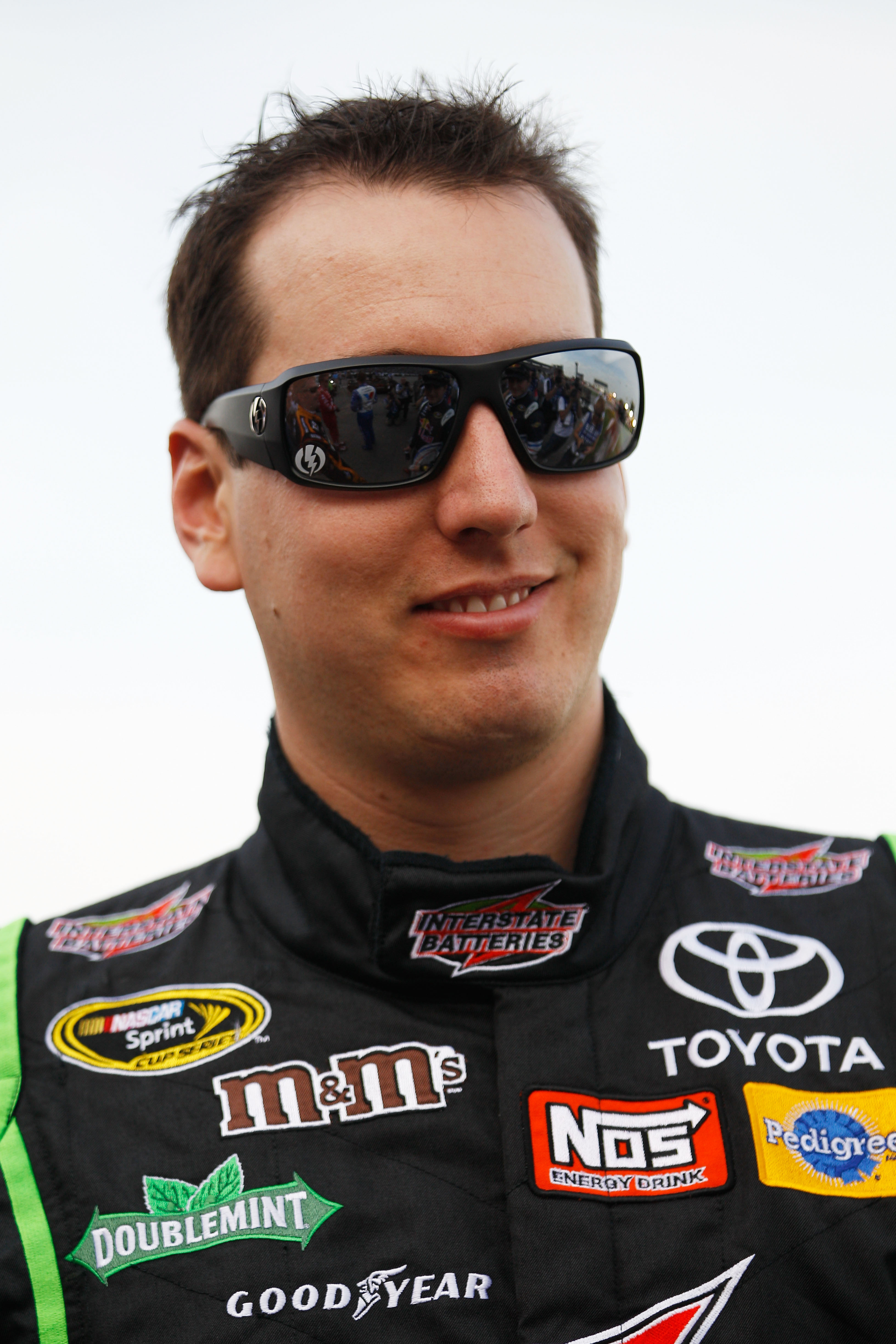 FORT WORTH, TX - APRIL 09:  Kyle Busch, driver of the #18 Interstate Batteries Toyota, stands on the grid prior to the start of the NASCAR Sprint Cup Series Samsung Mobile 500 at Texas Motor Speedway on April 9, 2011 in Fort Worth, Texas.  (Photo by Chris