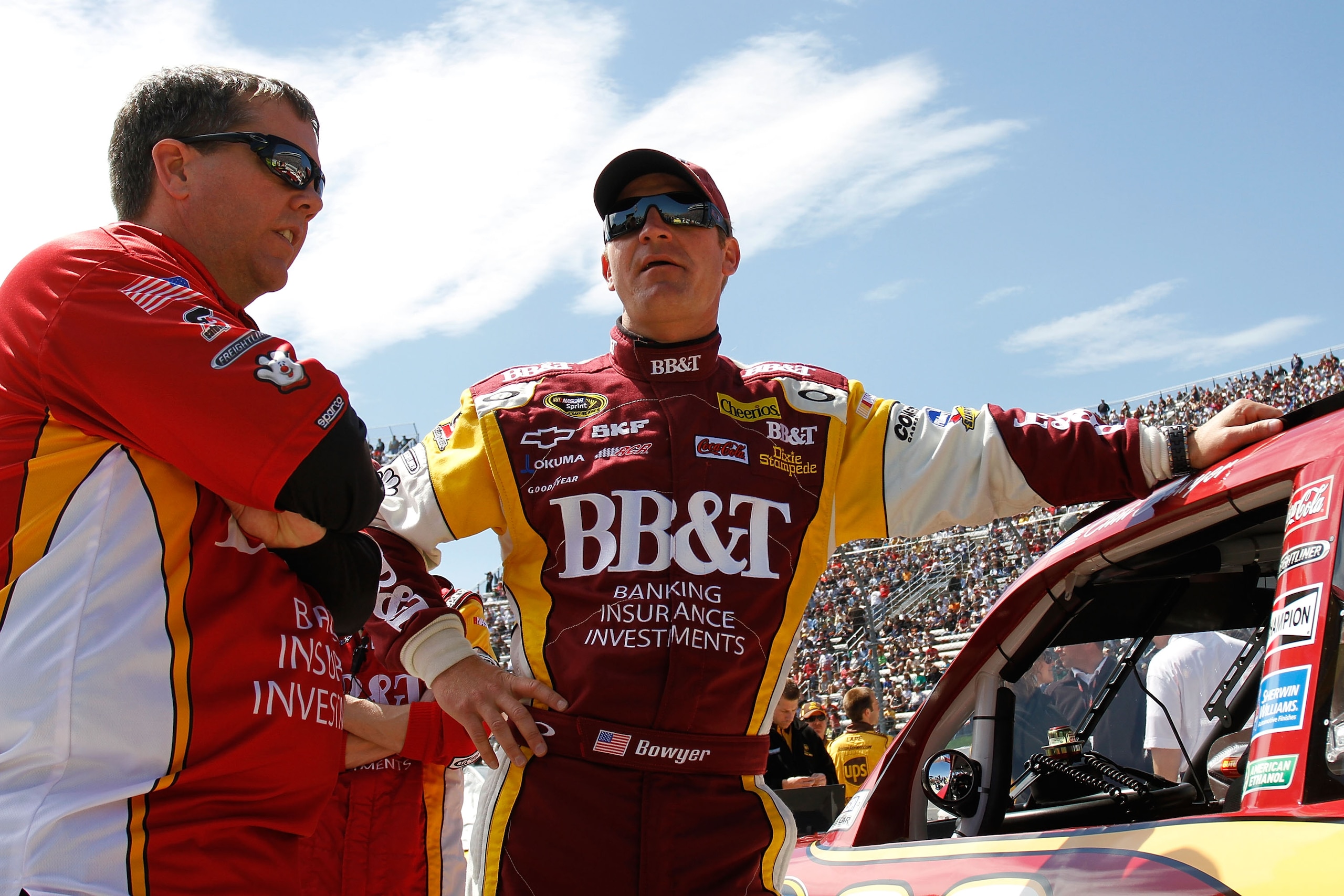 MARTINSVILLE, VA - APRIL 03:  Clint Bowyer (R) leans against the #33 BB&T Chevrolet as crew chief Shane Wilson (L) looks on while on the grid during pre-race activities for the NASCAR Sprint Cup Series Goody's Fast Relief 500 at Martinsville Speedway on A
