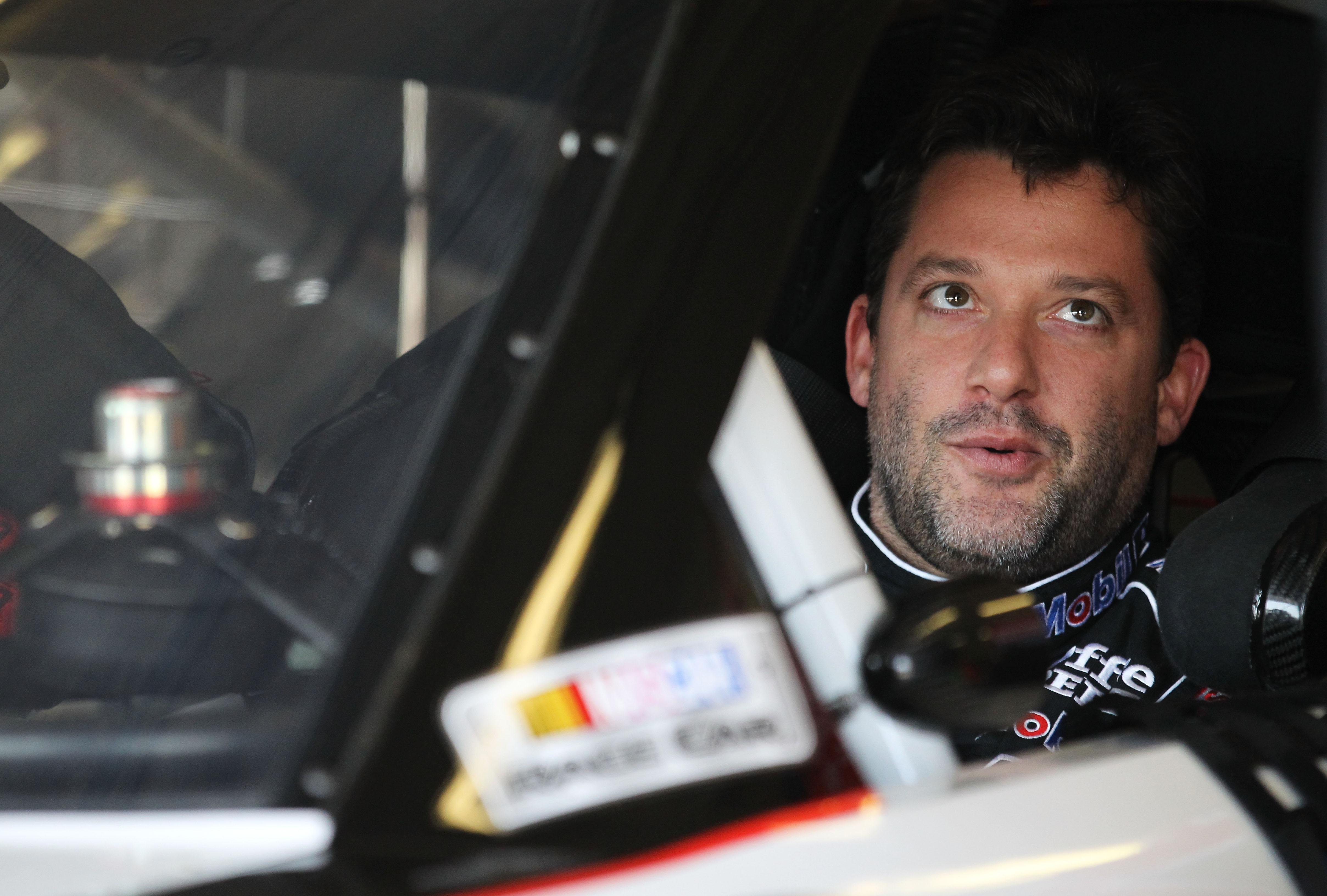 FORT WORTH, TX - APRIL 08:  Tony Stewart, driver of the #14 Mobil 1/Office Depot Chevrolet, sits in his car during practice for the NASCAR Sprint Cup Series Samsung Mobile 500 at Texas Motor Speedway on April 8, 2011 in Fort Worth, Texas.  (Photo by Ronal