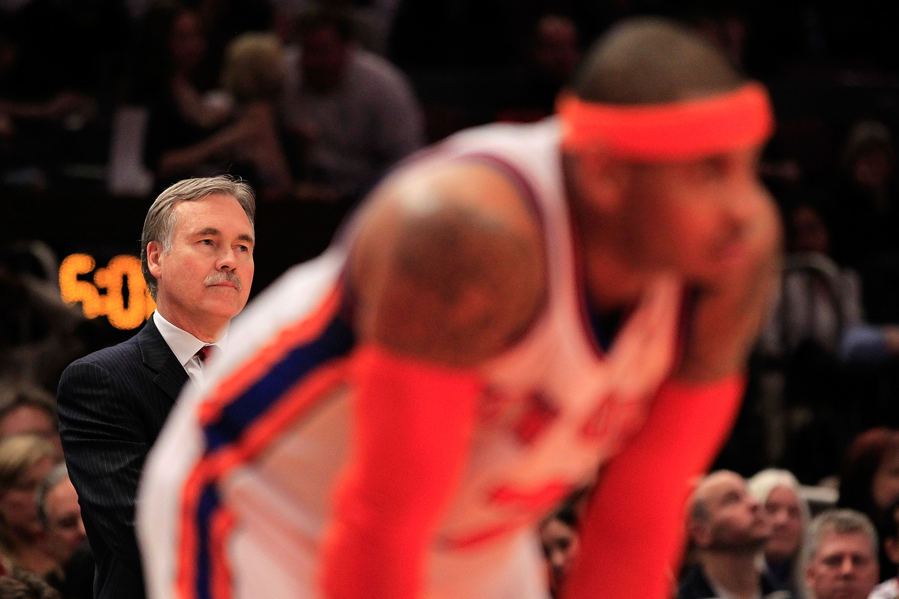 NEW YORK, NY - MARCH 30: Head coach Mike D'Antoni looks on over his player Carmelo Anthony #7 of the New York Knicks during the game against the New Jersey Nets at Madison Square Garden on March 30, 2011 in New York City. NOTE TO USER: User expressly ackn NEW YORK, NY - MARCH 30: Head coach Mike D'Antoni looks on over his player Carmelo Anthony #7 of the New York Knicks during the game against the New Jersey Nets at Madison Square Garden on March 30, 2011 in New York City. NOTE TO USER: User expressly ackn
