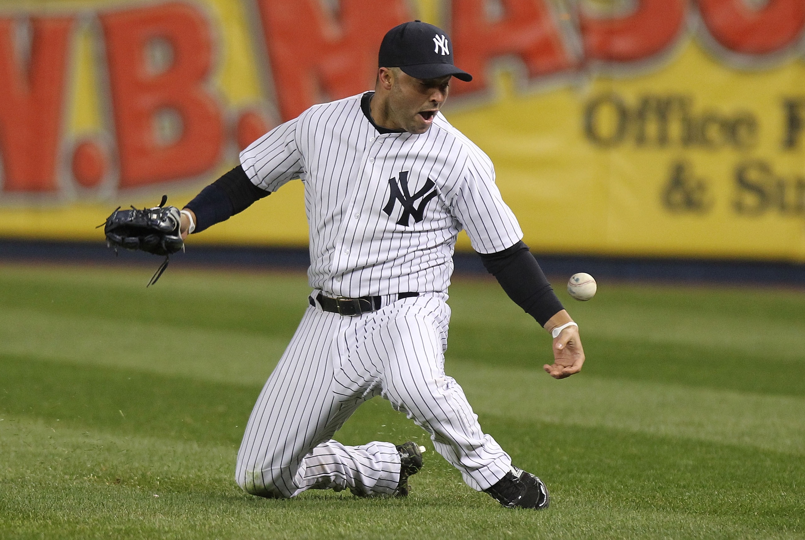 NEW YORK, NY - APRIL 05: Nick Swisher #33 of the New York Yankees fails to catch the fly ball of Delmon Young #21 of the Minnesota Twins resulting in a 3 run double at Yankee Stadium on April 5, 2011 in the Bronx borough of New York City.  (Photo by Nick 