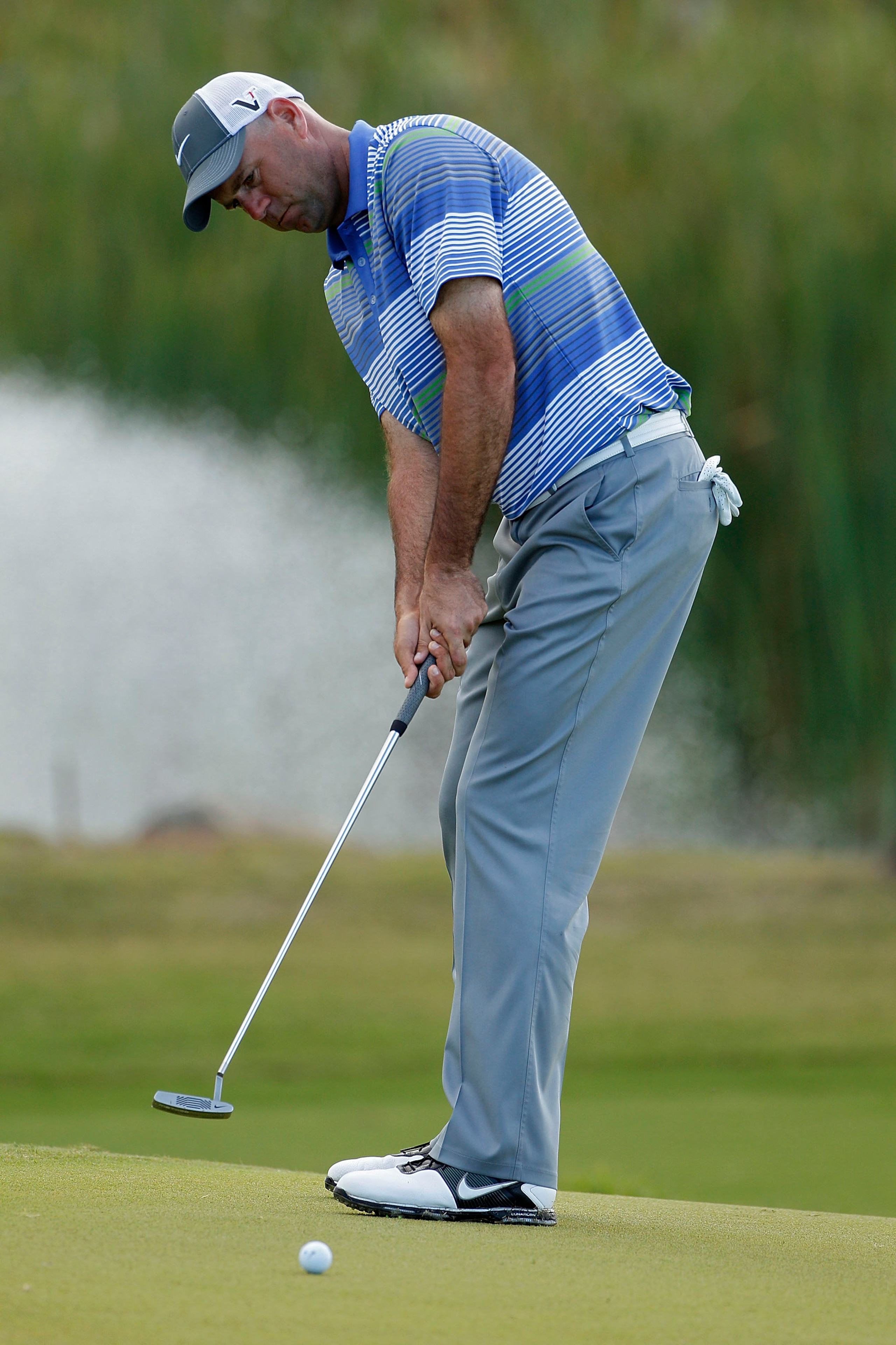 RIO GRANDE, PR - MARCH 10: Stewart Cink strokes a putt during the first round of the Puerto Rico Open presented by seepuertorico.com at Trump International Golf Club on March 10, 2011 in Rio Grande, Puerto Rico.  (Photo by Michael Cohen/Getty Images)