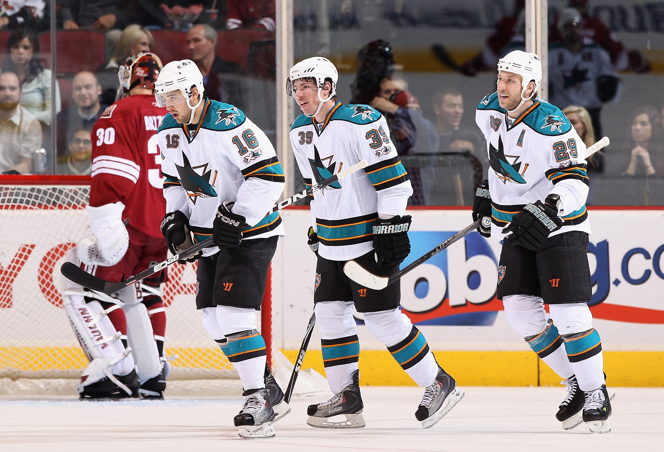 GLENDALE, AZ - MARCH 26: Ryane Clowe #29 of the San Jose Sharks celebrates with teammates after scoring against the Phoenix Coyotes during the NHL game at Jobing.com Arena on March 26, 2011 in Glendale, Arizona. The Sharks defeated the Coyotes 4-1. (Ph GLENDALE, AZ - MARCH 26: Ryane Clowe #29 of the San Jose Sharks celebrates with teammates after scoring against the Phoenix Coyotes during the NHL game at Jobing.com Arena on March 26, 2011 in Glendale, Arizona. The Sharks defeated the Coyotes 4-1. (Ph
