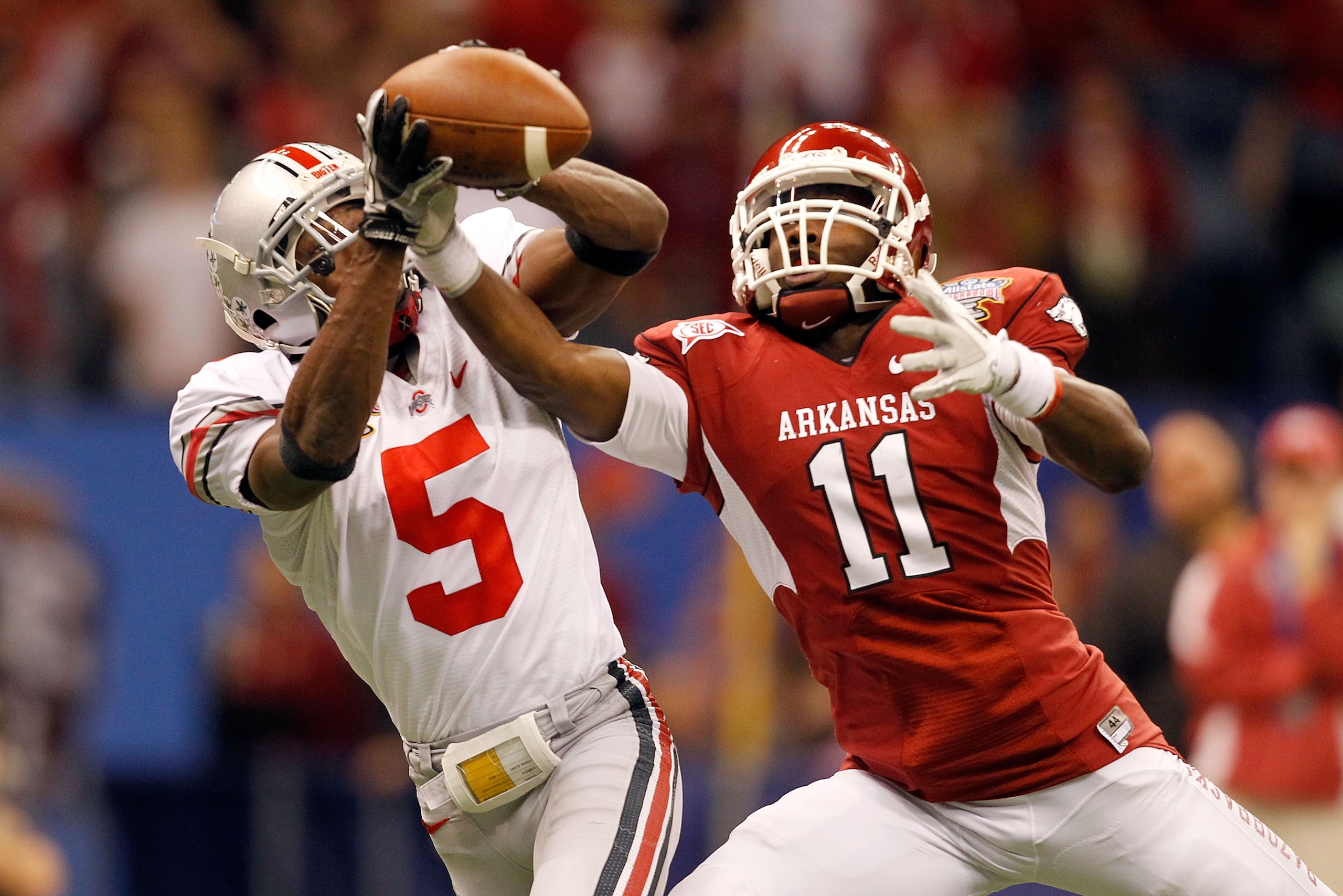 NEW ORLEANS, LA - JANUARY 04: Chimdi Chekwa #5 of the Ohio State Buckeyes is unable to come up with an interception as he goes up for the ball against Cobi Hamilton #11 of the Arkansas Razorbacks in the second quarter during the Allstate Sugar Bowl at th NEW ORLEANS, LA - JANUARY 04: Chimdi Chekwa #5 of the Ohio State Buckeyes is unable to come up with an interception as he goes up for the ball against Cobi Hamilton #11 of the Arkansas Razorbacks in the second quarter during the Allstate Sugar Bowl at th