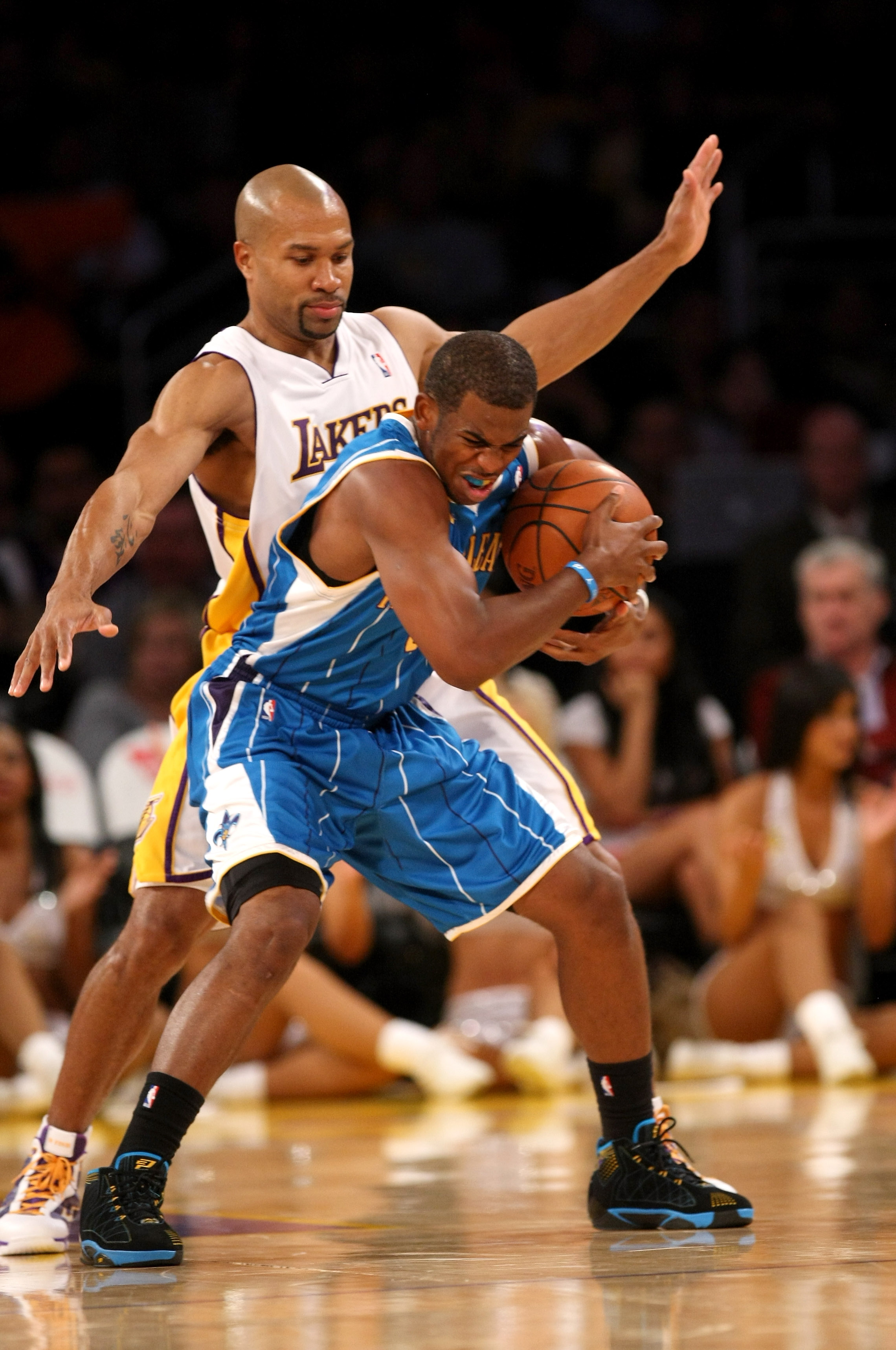 LOS ANGELES, CA - NOVEMBER 08:  Chris Paul #3 of the New Orleans Hornets fights to control the ball as Derek Fisher #3 of the Los Angeles Lakers defends on November 8, 2009 at Staples Center in Los Angeles, California. The Lakers won 104-88.  NOTE TO USER
