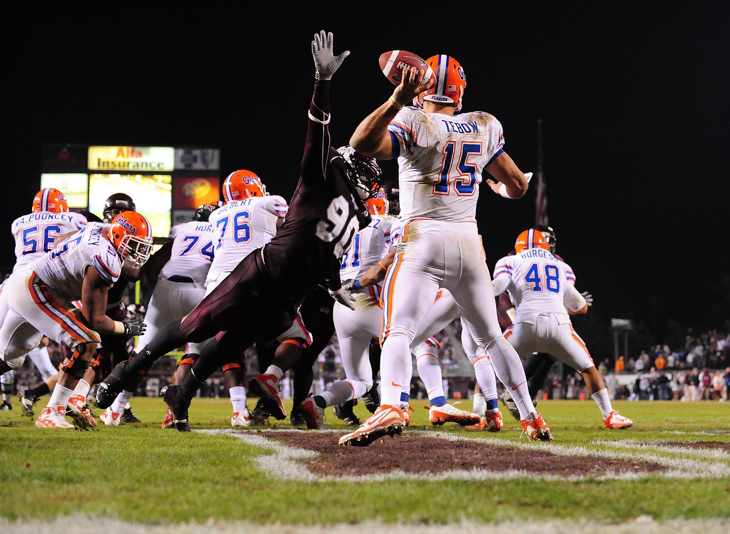 STARKVILLE, MS - OCTOBER 24: Quarterback Tim Tebow # 15 of the Florida Gators is rushed by Pernell McPhee # 90 of Mississippi State, resulting in an interception return for a touchdown, during the second half, at Davis Wade Stadium on October 24, 2009 i STARKVILLE, MS - OCTOBER 24: Quarterback Tim Tebow # 15 of the Florida Gators is rushed by Pernell McPhee # 90 of Mississippi State, resulting in an interception return for a touchdown, during the second half, at Davis Wade Stadium on October 24, 2009 i