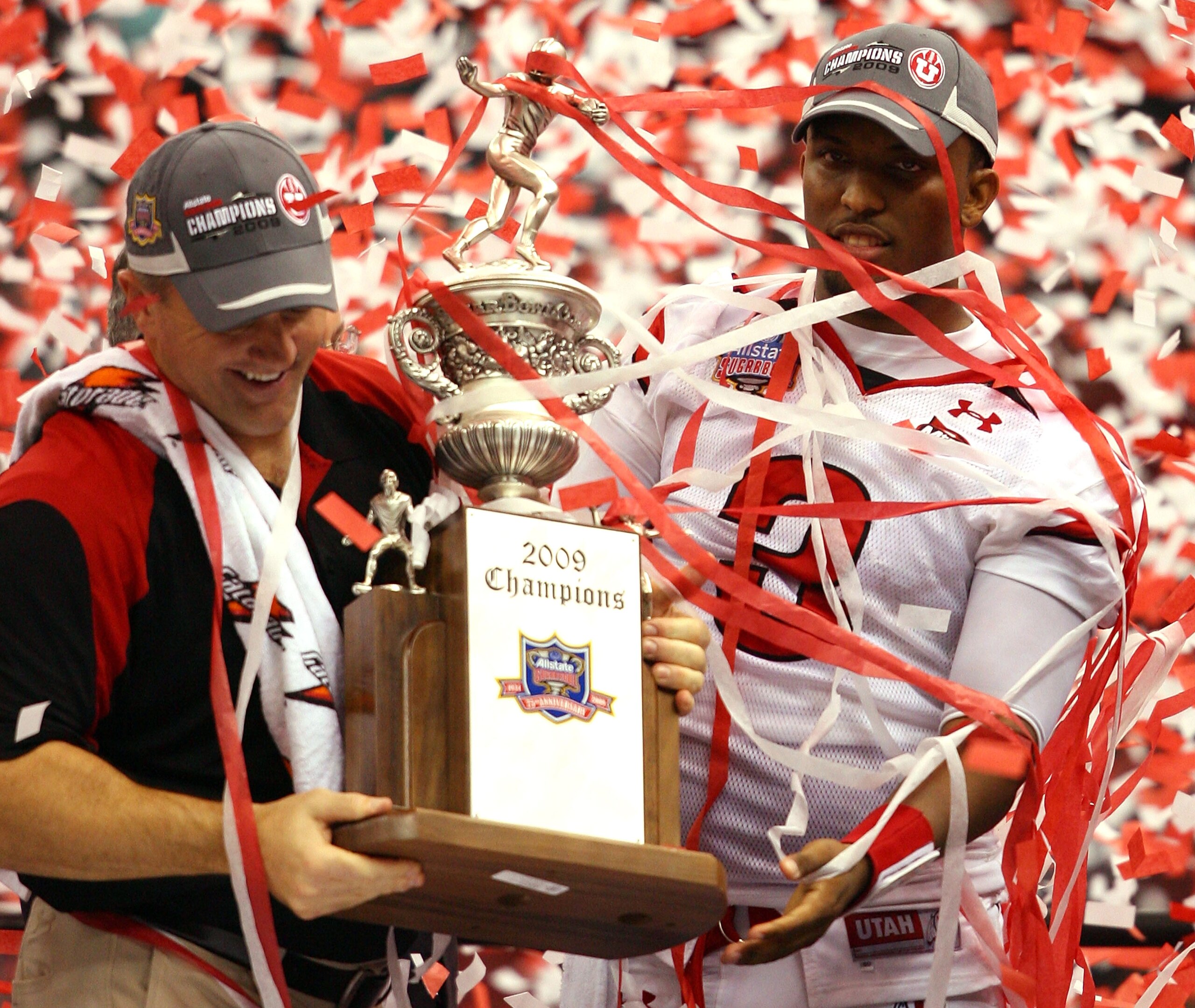 NEW ORLEANS - JANUARY 02:  Head coach Kyle Whittingham and quarterback Brian Johnson #3 of the Utah Utes celebrates after defeating the Alabama Crimson Tide 31-17 during the 75th Allstate Sugar Bowl at the Louisiana Superdome on January 2, 2009 in New Orl