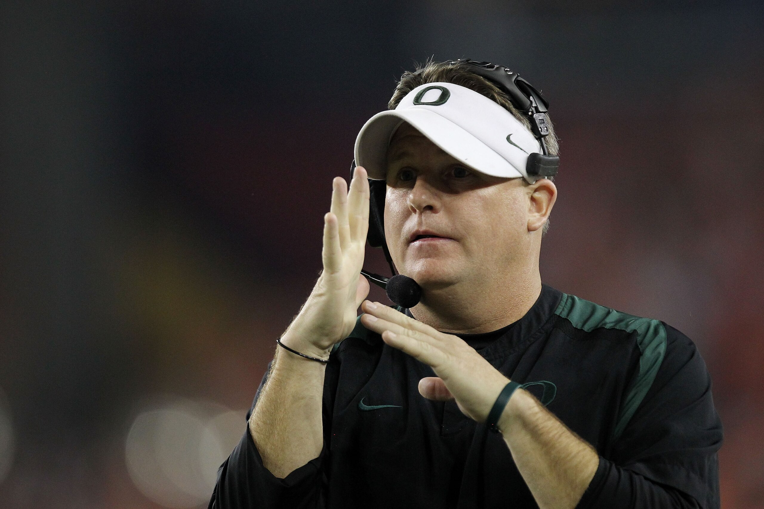GLENDALE, AZ - JANUARY 10:  Head coach Chip Kelly of the Oregon Ducks calls a time out during their 22-19 loss to the Auburn Tigers during the Tostitos BCS National Championship Game at University of Phoenix Stadium on January 10, 2011 in Glendale, Arizon