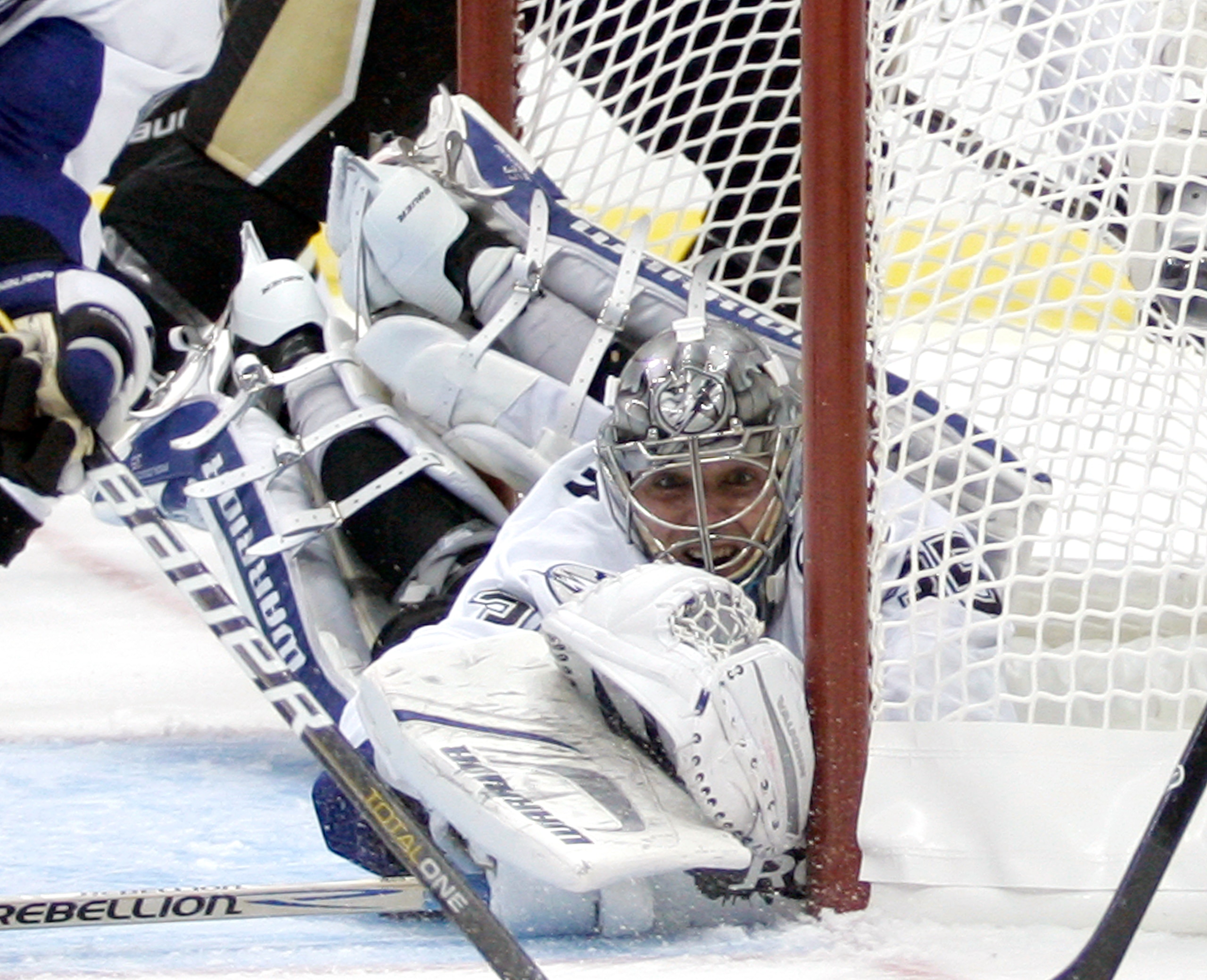 PITTSBURGH, PA - APRIL 13: Dwayne Roloson #35 of the Tampa Bay Lightning makes a save against the Pittsburgh Penguins in Game One of the Eastern Conference Quarterfinals during the 2011 NHL Stanley Cup Playoffs at Consol Energy Center on April 13, 2011 in PITTSBURGH, PA - APRIL 13: Dwayne Roloson #35 of the Tampa Bay Lightning makes a save against the Pittsburgh Penguins in Game One of the Eastern Conference Quarterfinals during the 2011 NHL Stanley Cup Playoffs at Consol Energy Center on April 13, 2011 in