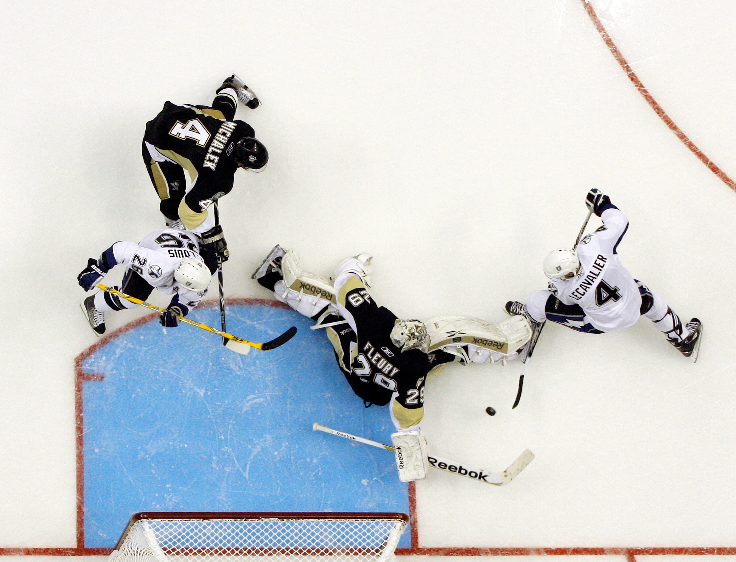 PITTSBURGH, PA - APRIL 13: Marc-Andre Fleury #29 of the Pittsburgh Penguins makes a save on Vincent Lecavalier #4 of the Tampa Bay Lightning in Game One of the Eastern Conference Quarterfinals during the 2011 NHL Stanley Cup Playoffs at Consol Energy Cent PITTSBURGH, PA - APRIL 13: Marc-Andre Fleury #29 of the Pittsburgh Penguins makes a save on Vincent Lecavalier #4 of the Tampa Bay Lightning in Game One of the Eastern Conference Quarterfinals during the 2011 NHL Stanley Cup Playoffs at Consol Energy Cent
