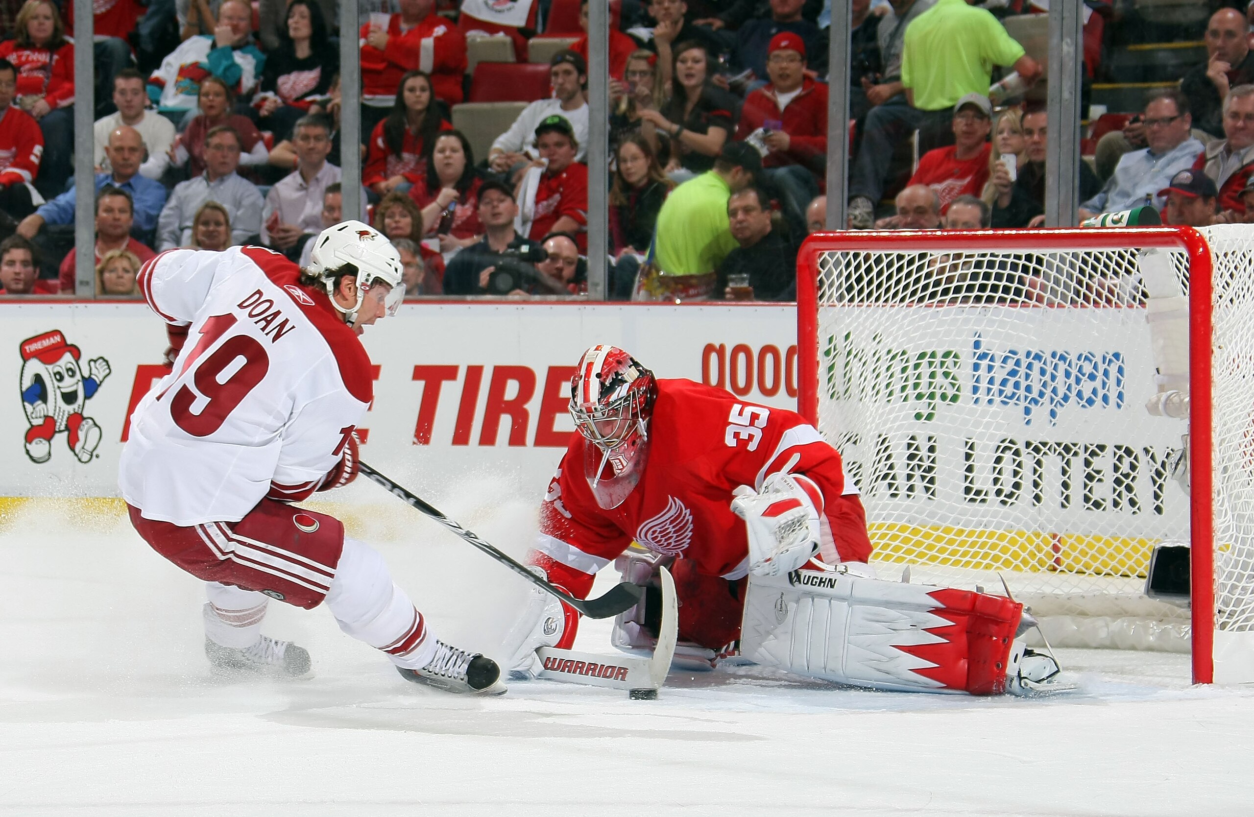 DETROIT, MI - APRIL 13: Shane Doan #19 of the Phoenix Coyotes is stopped on a shorthanded breakaway by Jimmy Howard #35 of the Detroit Red Wings as they play in Game One of the Western Conference Quarterfinals during the 2011 NHL Stanley Cup Playoffs at DETROIT, MI - APRIL 13: Shane Doan #19 of the Phoenix Coyotes is stopped on a shorthanded breakaway by Jimmy Howard #35 of the Detroit Red Wings as they play in Game One of the Western Conference Quarterfinals during the 2011 NHL Stanley Cup Playoffs at