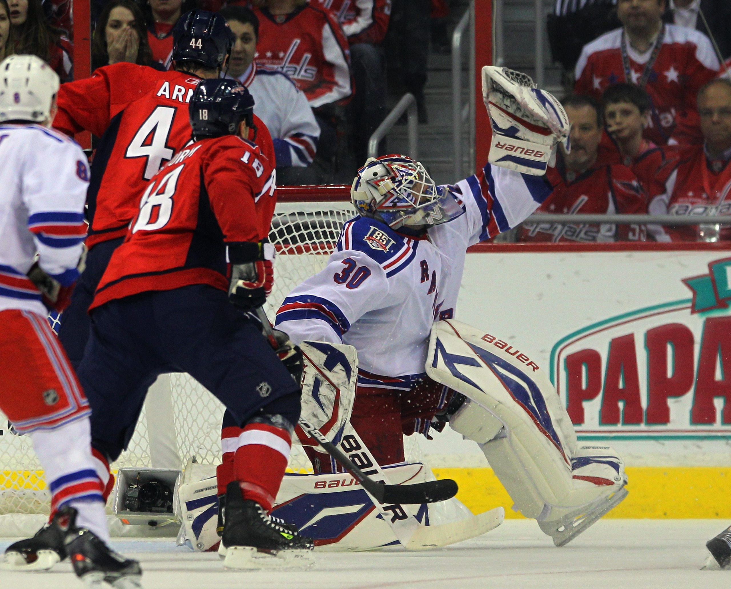 WASHINGTON, DC - APRIL 13: Henrik Lundqvist #30 of the New York Rangers comes up with a first period save on Mike Green #52 of the Washington Capitals (not shown) in Game One of the Eastern Conference Quarterfinals during the 2011 NHL Stanley Cup Playoffs WASHINGTON, DC - APRIL 13: Henrik Lundqvist #30 of the New York Rangers comes up with a first period save on Mike Green #52 of the Washington Capitals (not shown) in Game One of the Eastern Conference Quarterfinals during the 2011 NHL Stanley Cup Playoffs