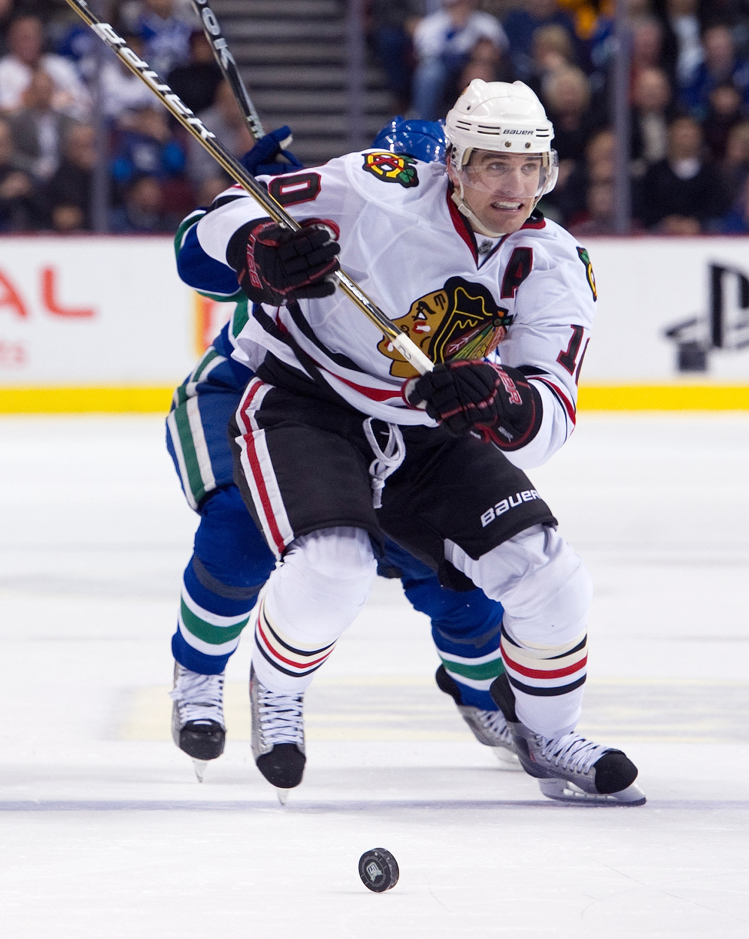 VANCOUVER, CANADA - FEBRUARY 4: Patrick Sharp #10 of the Chicago Blackhawks chases the loose puck with Cody Hodgson #39 of the Vancouver Canucks in pursuit during the third period in NHL action on February 04, 2011 at Rogers Arena in Vancouver, British Co VANCOUVER, CANADA - FEBRUARY 4: Patrick Sharp #10 of the Chicago Blackhawks chases the loose puck with Cody Hodgson #39 of the Vancouver Canucks in pursuit during the third period in NHL action on February 04, 2011 at Rogers Arena in Vancouver, British Co