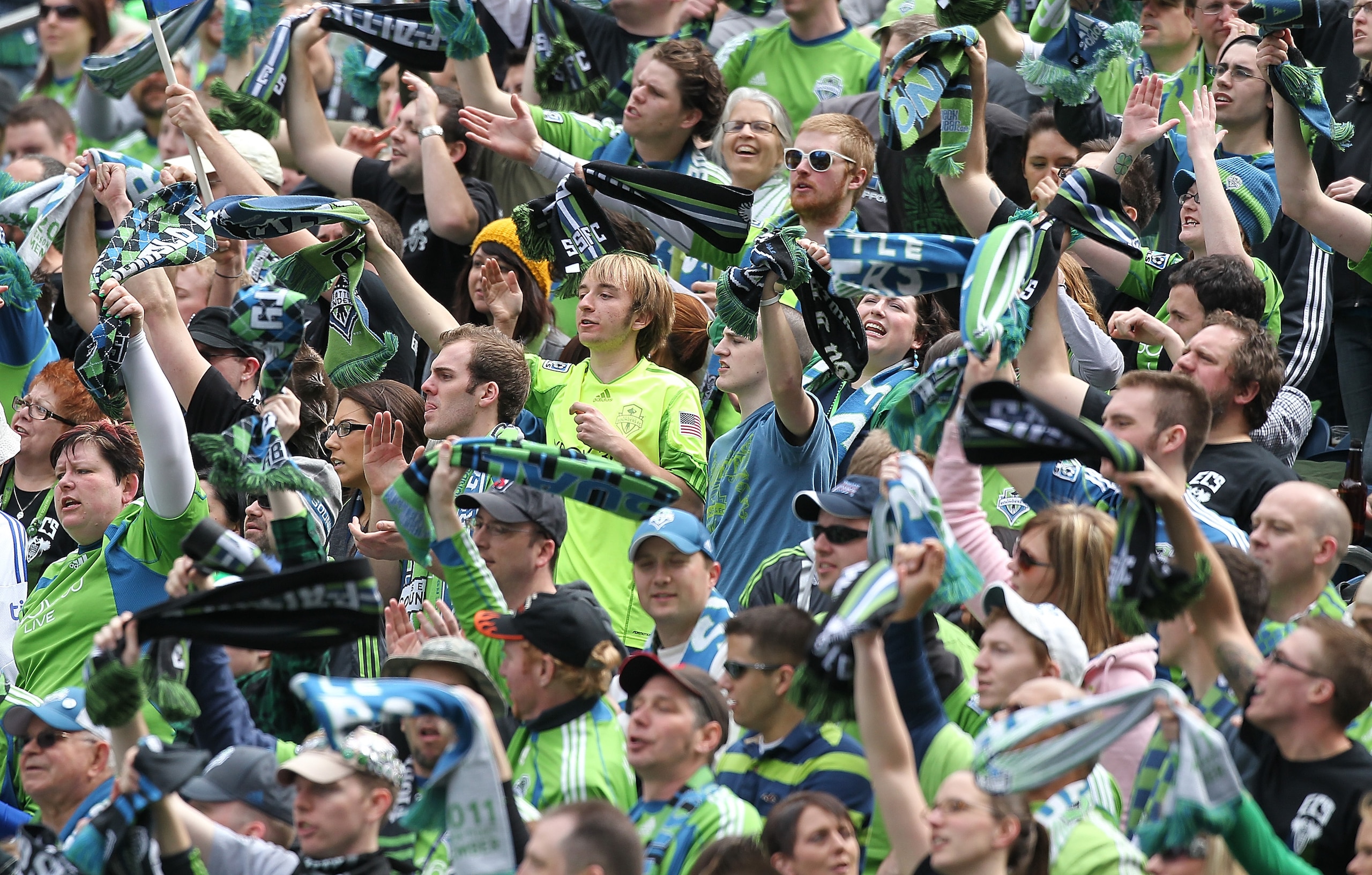 SEATTLE - APRIL 09:  Fans of the Seattle Sounders FC cheer during the game against the Chicago Fire at Qwest Field on April 9, 2011 in Seattle, Washington. The Sounders defeated the Fire 2-1. (Photo by Otto Greule Jr/Getty Images)