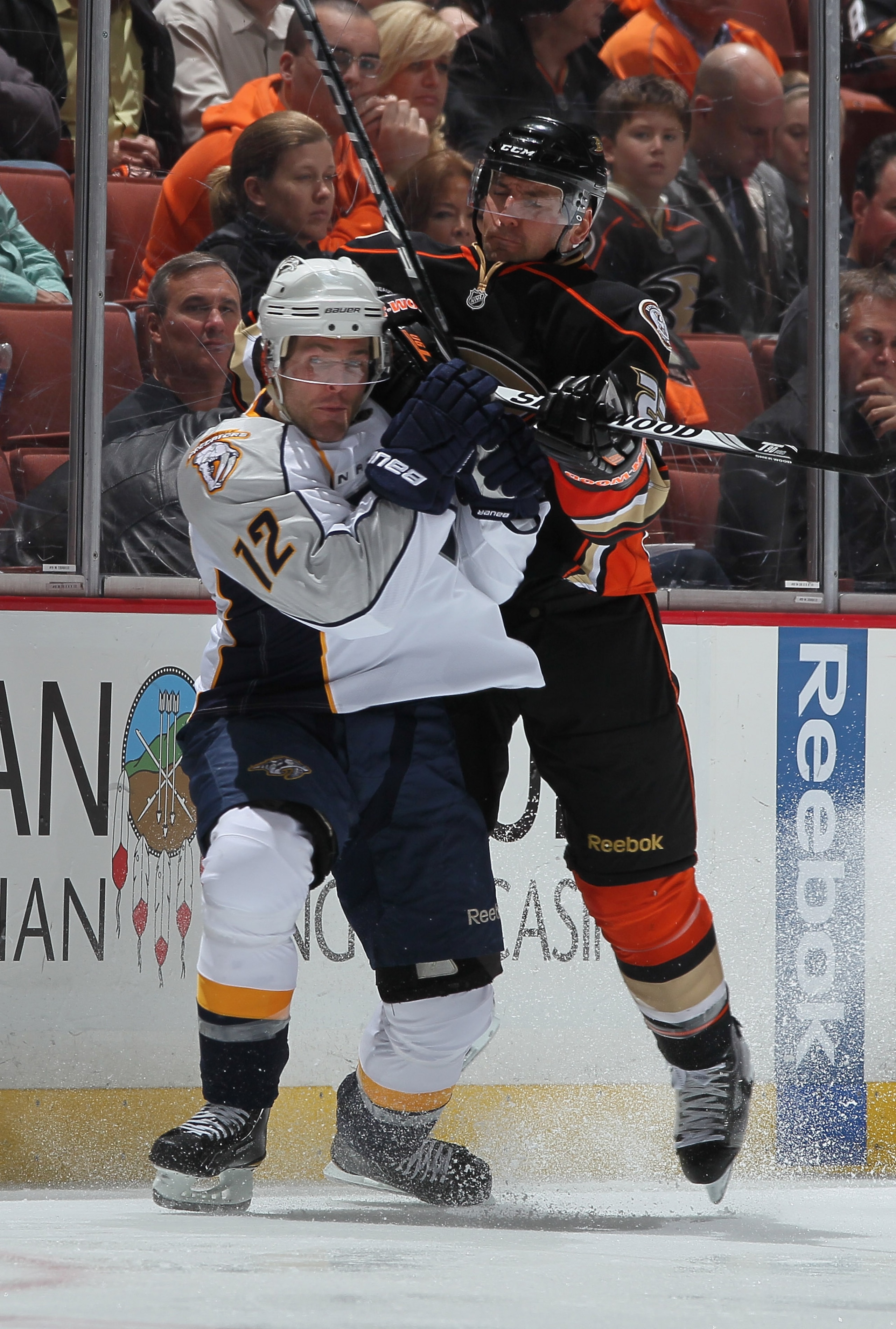 ANAHEIM, CA - APRIL 13: Mike Fisher #12 of the Nashville Predators is checked by Francois Beauchemin #23 of the Anaheim Ducks in the third period of Game One of the Western Conference Quarterfinals during the 2011 NHL Stanley Cup Playoffs at Honda Center ANAHEIM, CA - APRIL 13: Mike Fisher #12 of the Nashville Predators is checked by Francois Beauchemin #23 of the Anaheim Ducks in the third period of Game One of the Western Conference Quarterfinals during the 2011 NHL Stanley Cup Playoffs at Honda Center