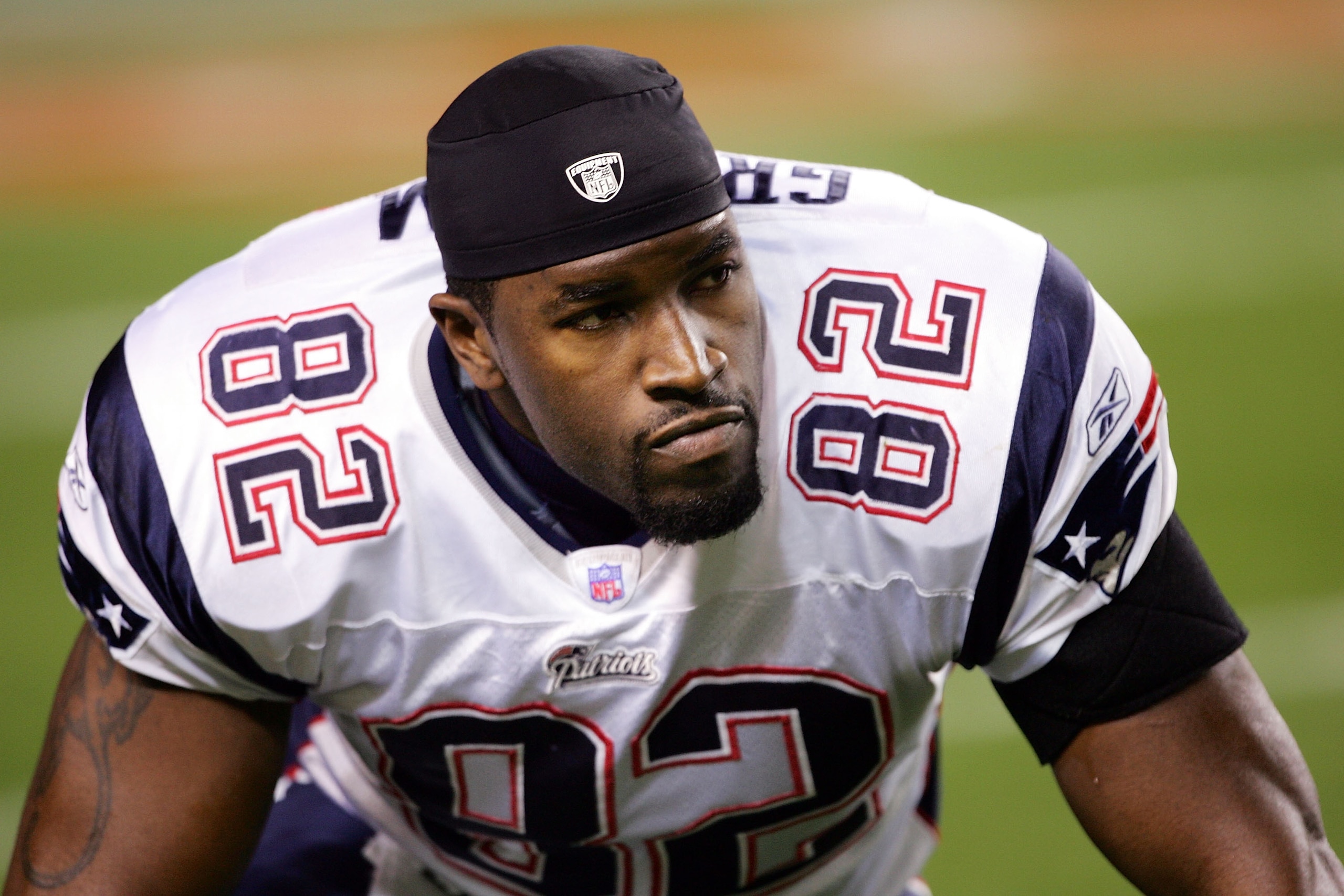 DENVER - JANUARY 14:  Daniel Graham #82 of the New England Patriots sits on the field before the AFC Divisional Playoff game against the Denver Broncos on January 14, 2006 at Invesco Field at Mile High in Denver, Colorado.  (Photo by Doug Pensinger/Getty