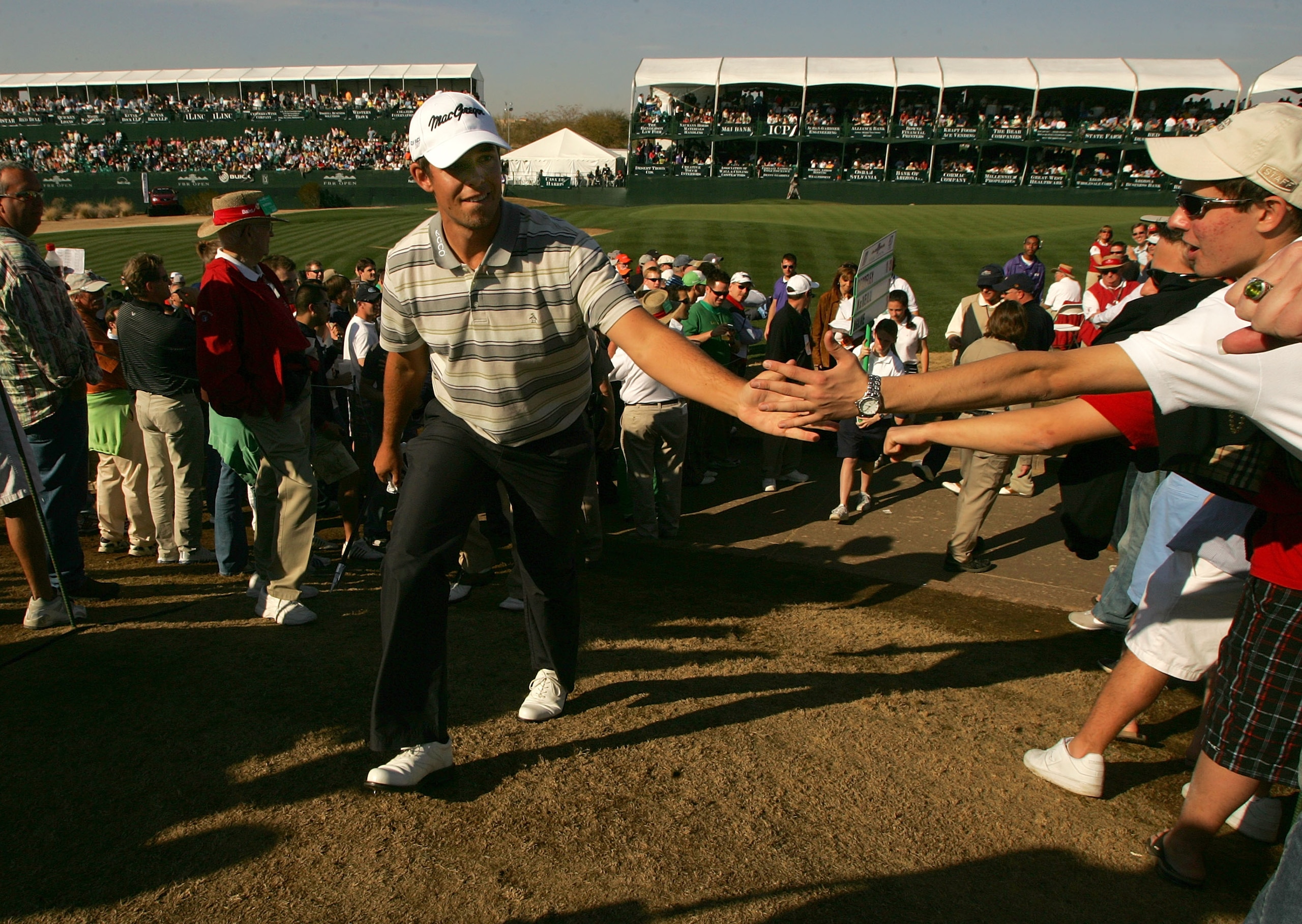 SCOTTSDALE, AZ - FEBRUARY 3:  Aaron Baddeley of Austalia greets the crowd as he makes his way from the sixteenth green during the third round of the FBR Open on February 3, 2007 at TPC Scottsdale in Scottsdale, Arizona.  Baddeley finished the day in secon